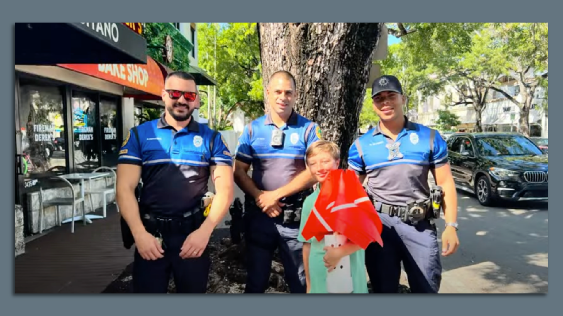 Lucas Kwiatkowski with Miami Police officers