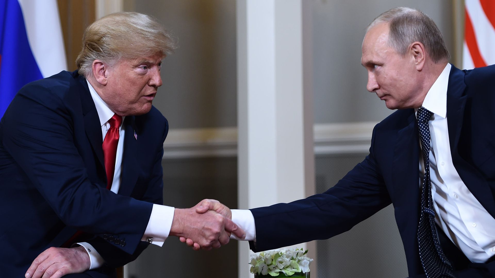 Trump and Putin shake hands
