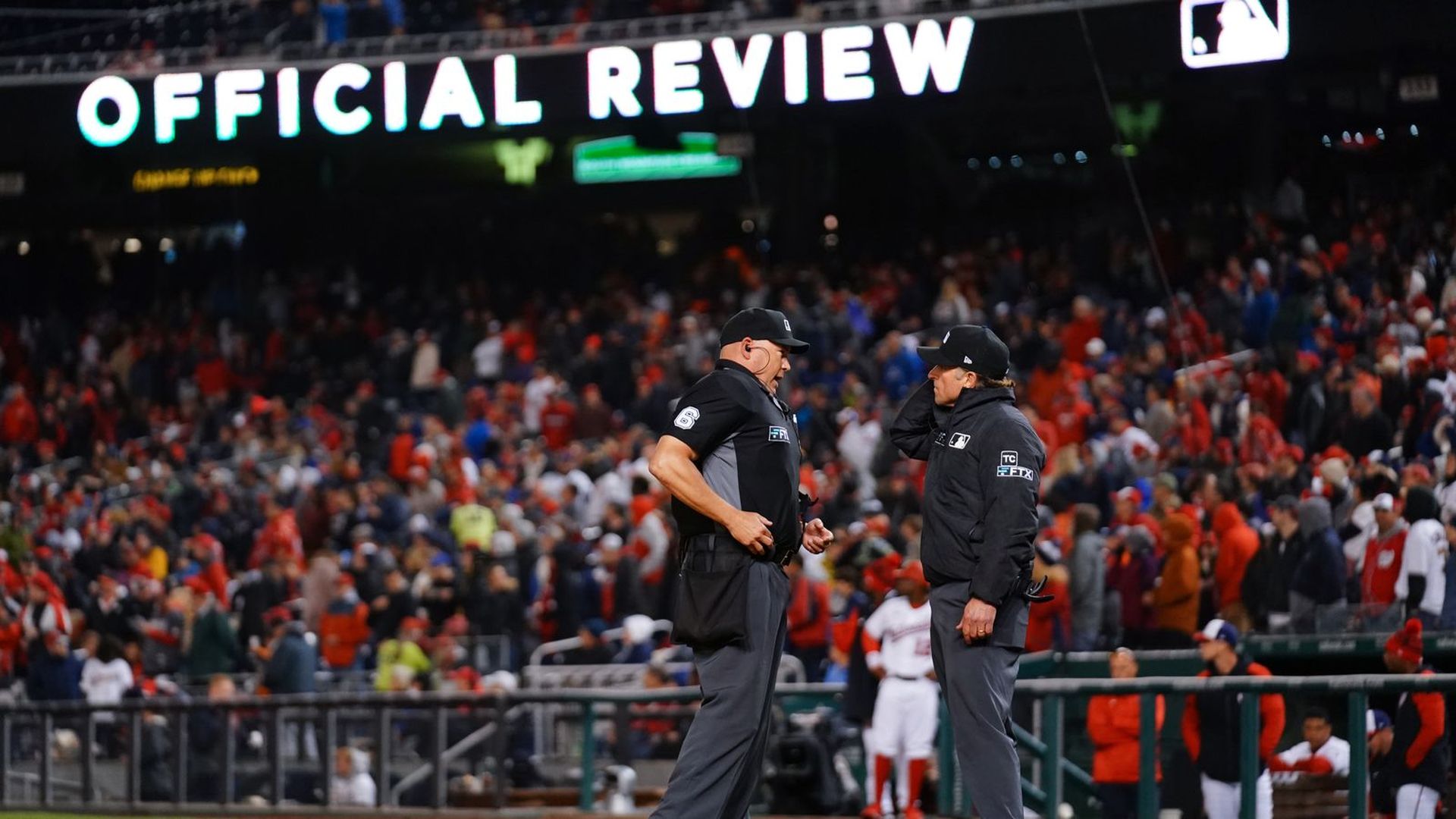 Umpires confer during an official review.