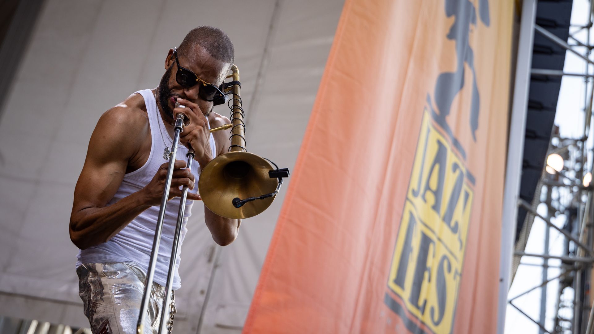 Trombone Shorty performs on stage. 