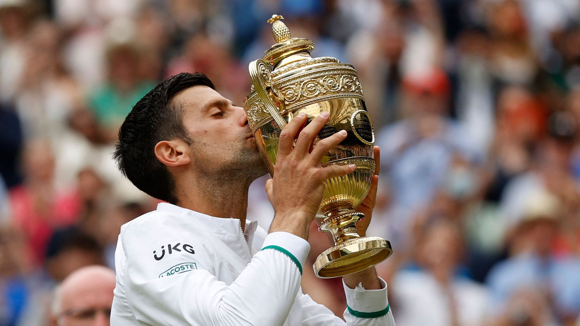 Djokovic kissing the winner's trophy at last year's Wimbledon Championships