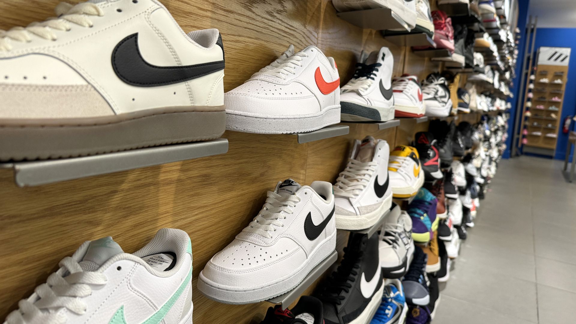 Sneakers on a store shelf.
