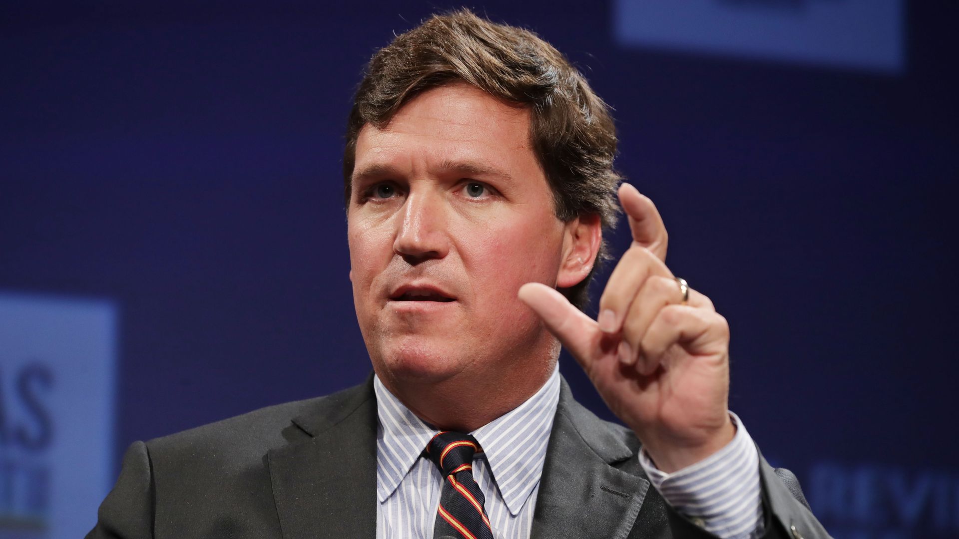 Fox News host Tucker Carlson speaking 