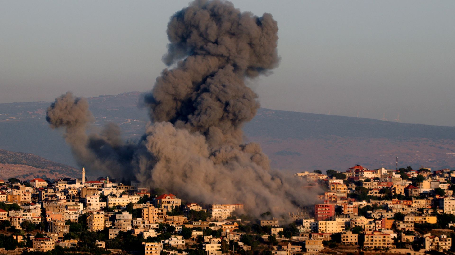 Black smoke billows following an Israeli air strike that targeted a house in the southern Lebanese village of Khiam near the Lebanese-Israeli border on June 21, 2024,