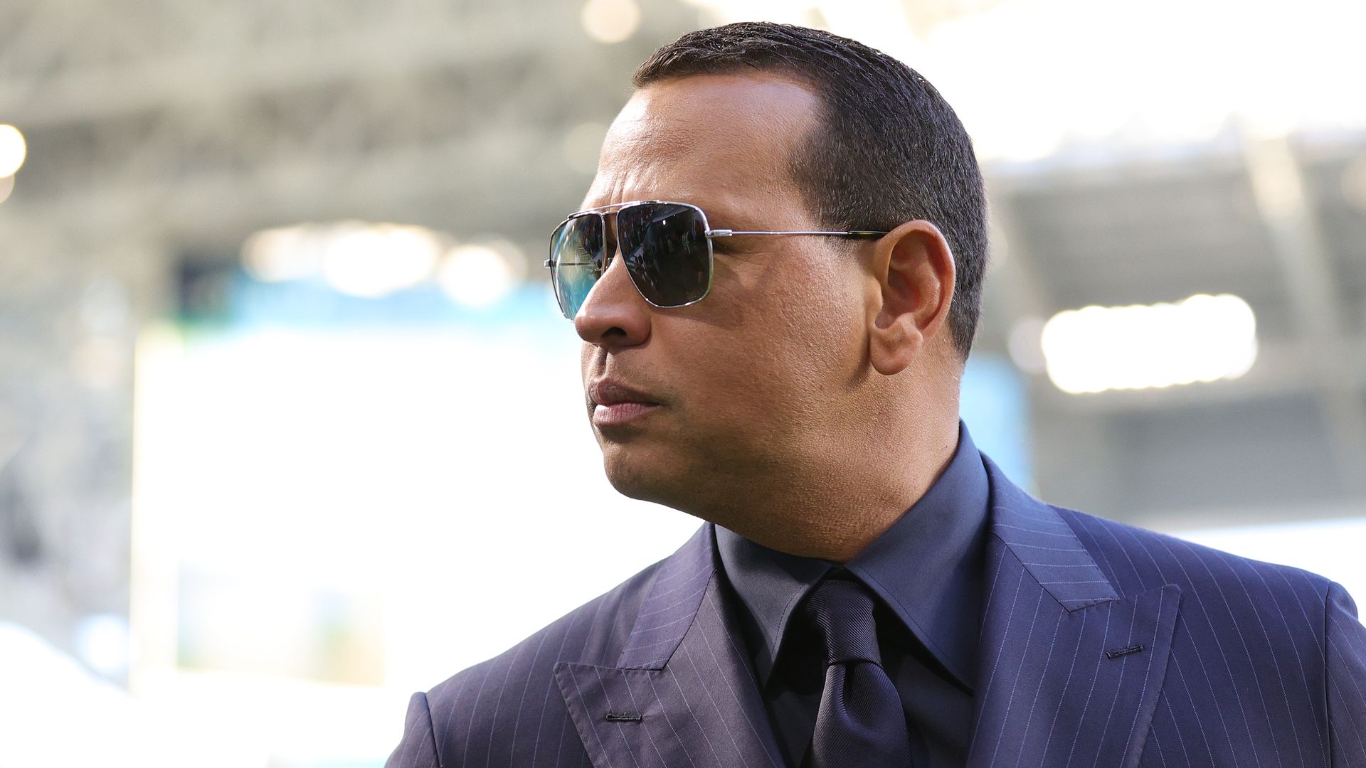 Alex Rodriguez looks off the left wearing sunglasses 