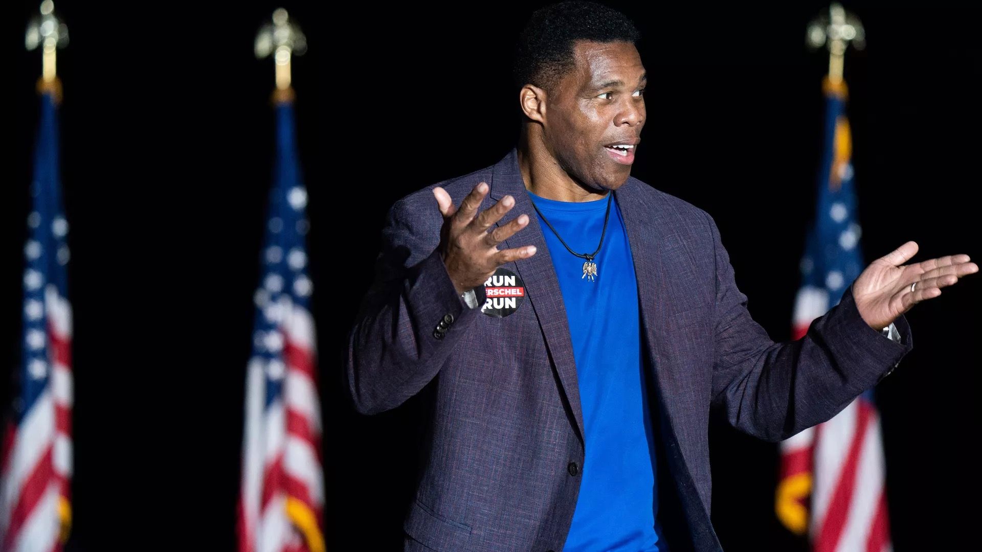 Georgia Senate candidate Herschel Walker is seen speaking at a political event.