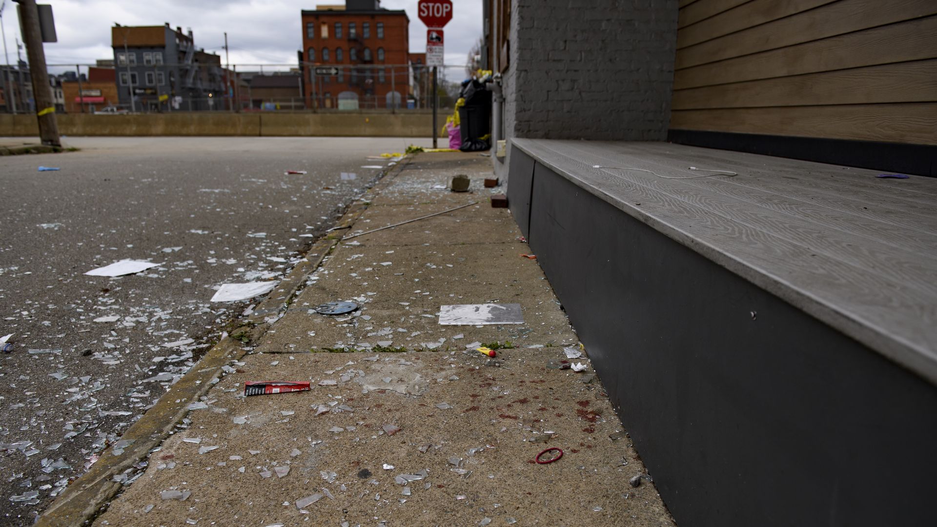Broken glass and bloodstains are seen outside an Airbnb apartment rental along Suismon Street on April 17, 2022 in Pittsburgh, Pennsylvania.