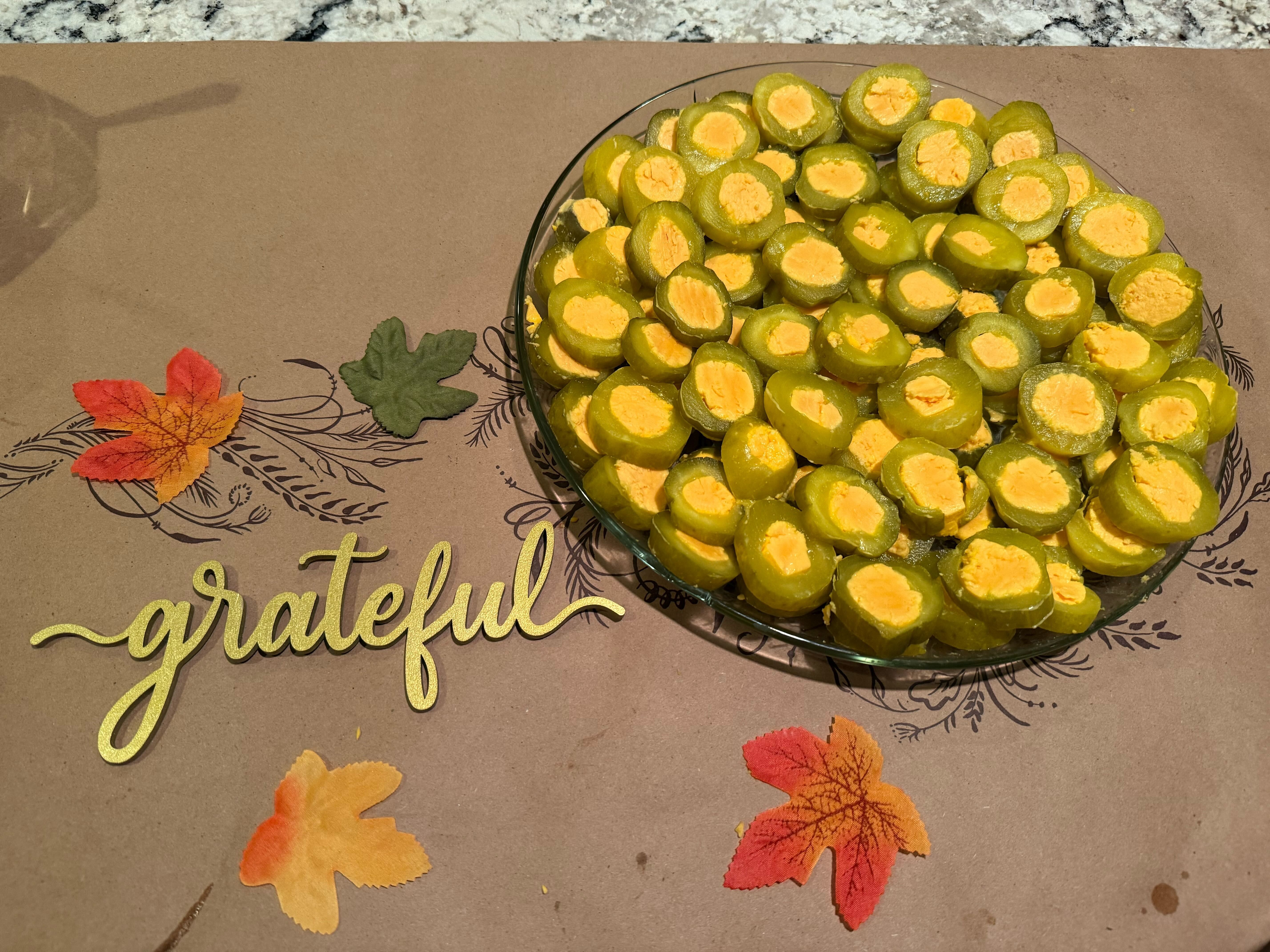 Sliced pickles stuffed with cheese.