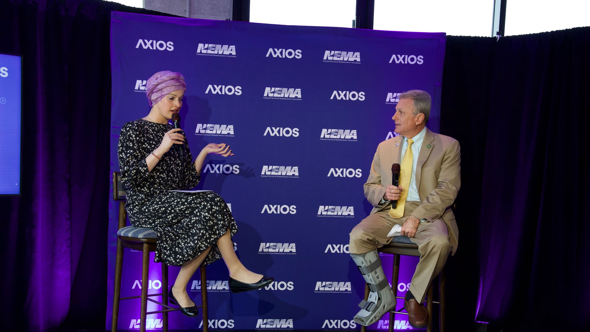 Axios’ Jael Holzman on stage with Rep. Carter. Credit: Hector Emanuel for Axios.