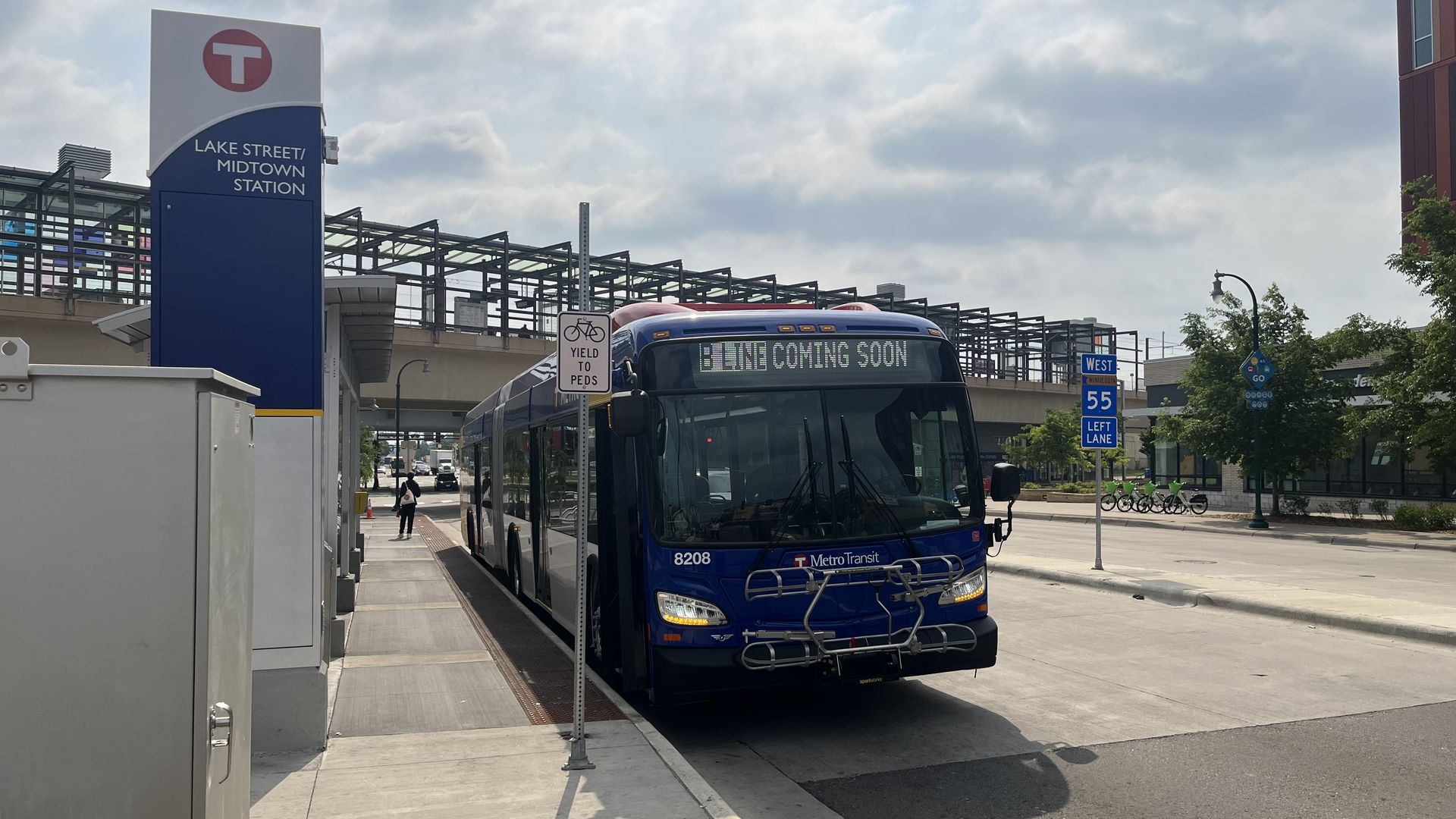 A photo of a bus at a station with B Line coming soon scrolling on the front