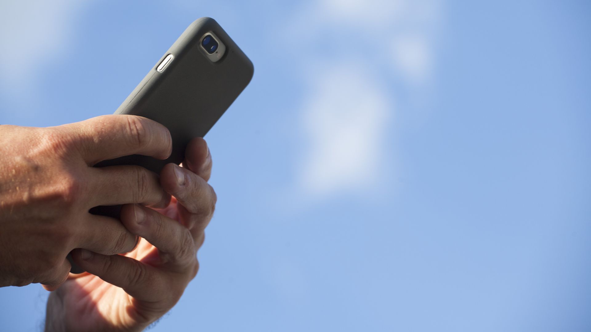 Hands texting on an iphone