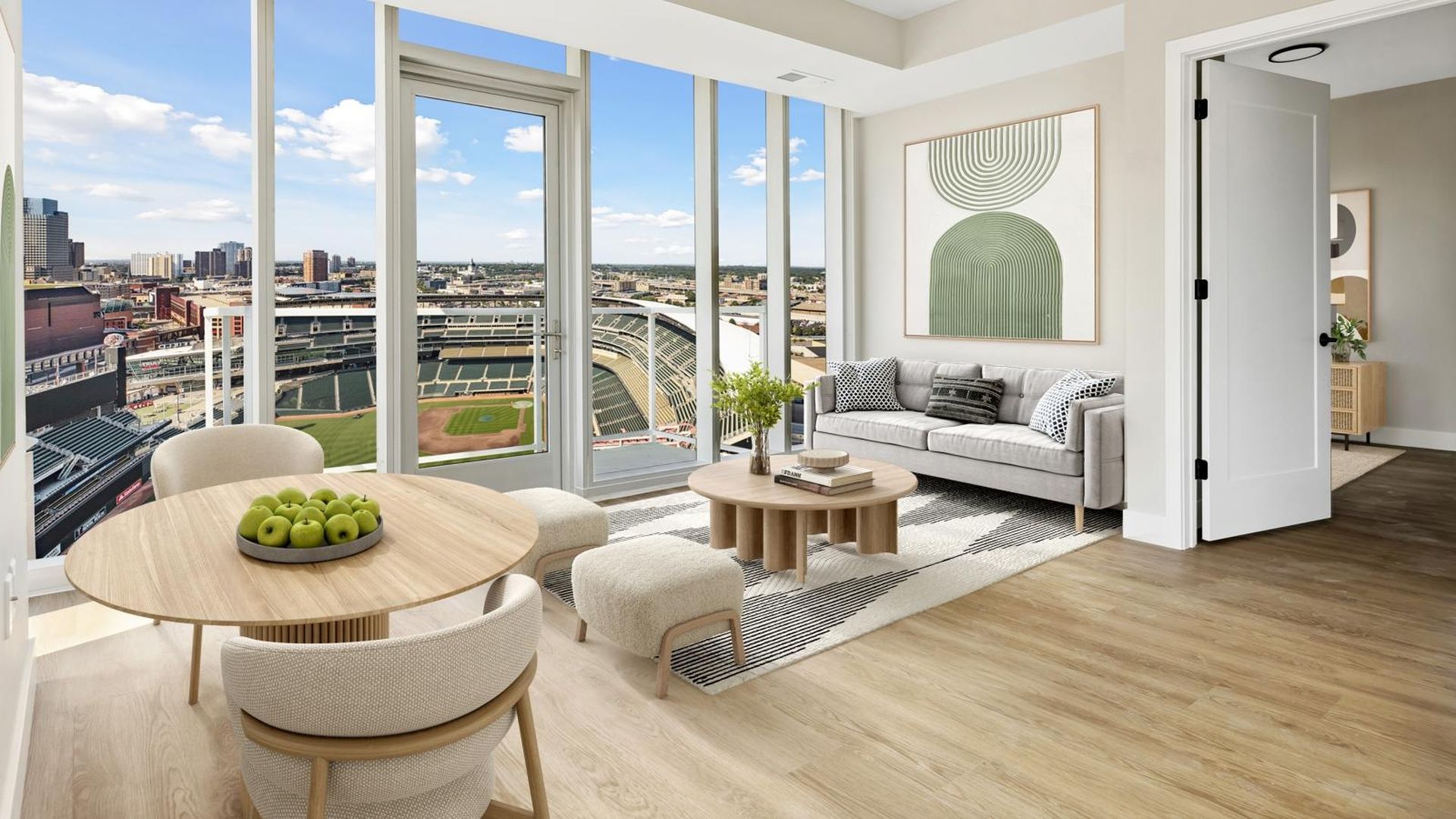 The interior of an apartment with windows looking out at target field