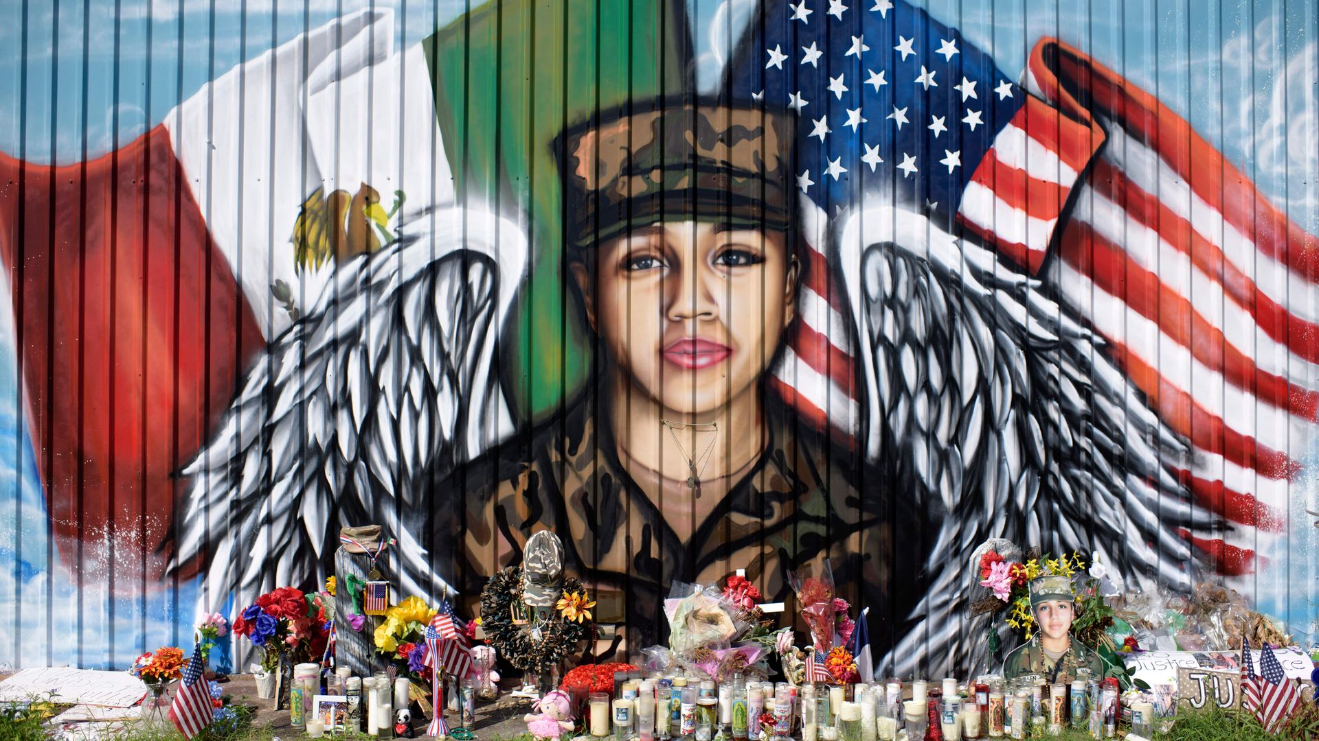 Candles and flowers decorate a makeshift memorial for US Army Specialist Vanessa Guillen