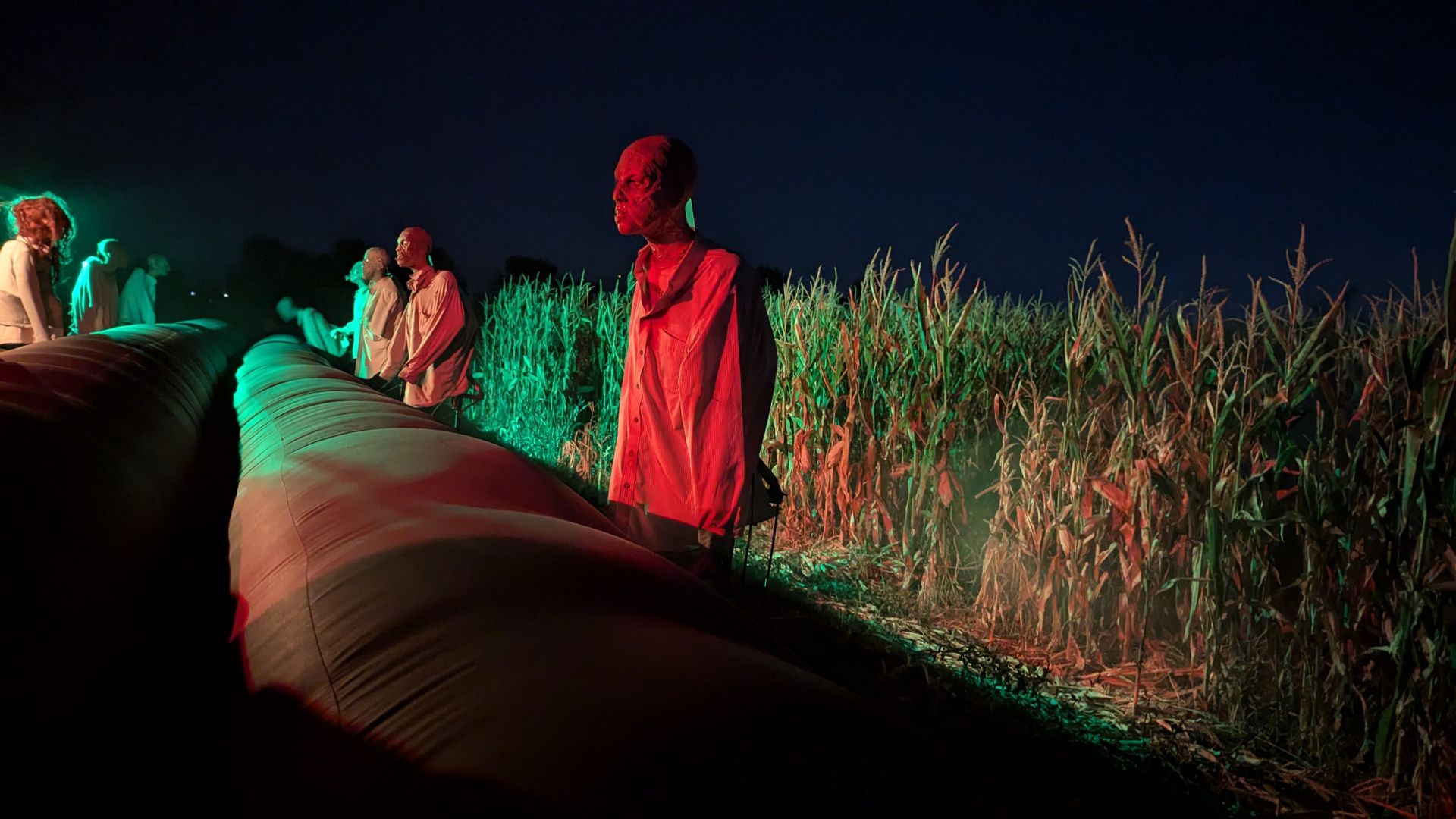 Inflatable cushions to slide through between demons near a cornfield.