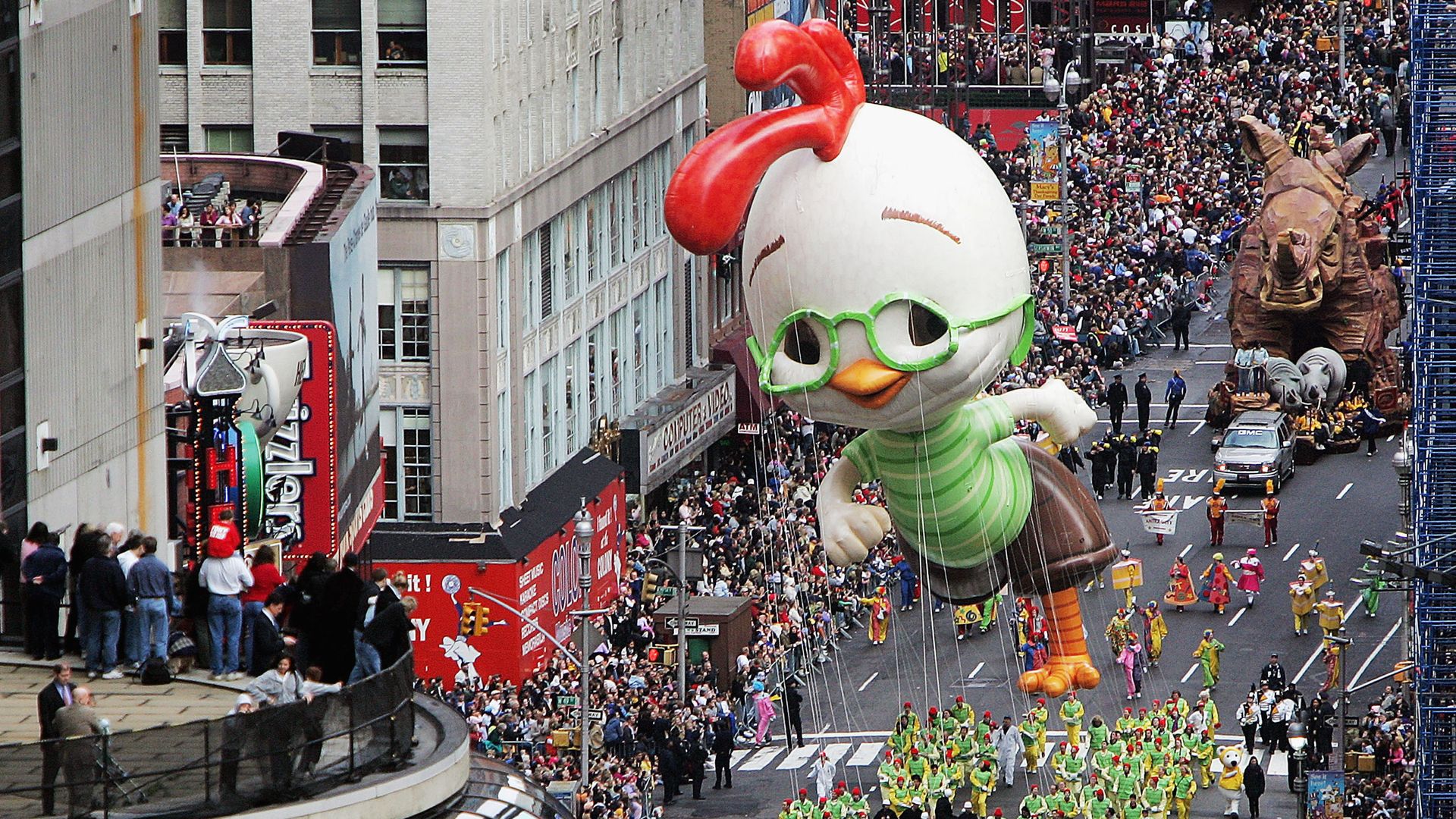 A float surrounded by people at the parade.