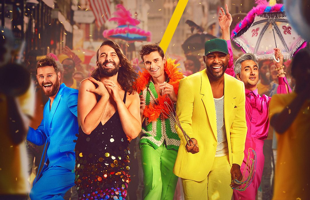 The cast of Queer Eye smile at the camera in New Orleans during a parade