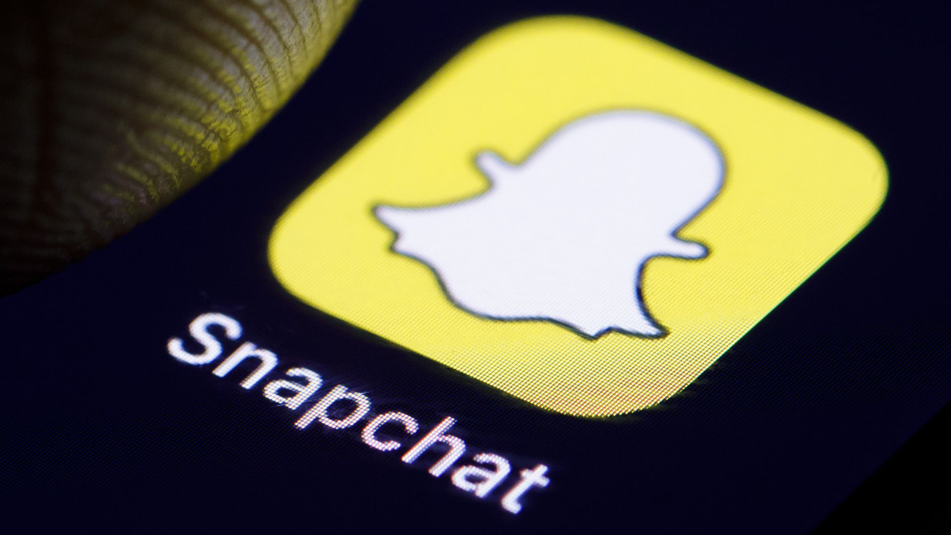 Photo of close-up of Snapchat's mobile app icon on a smartphone. 