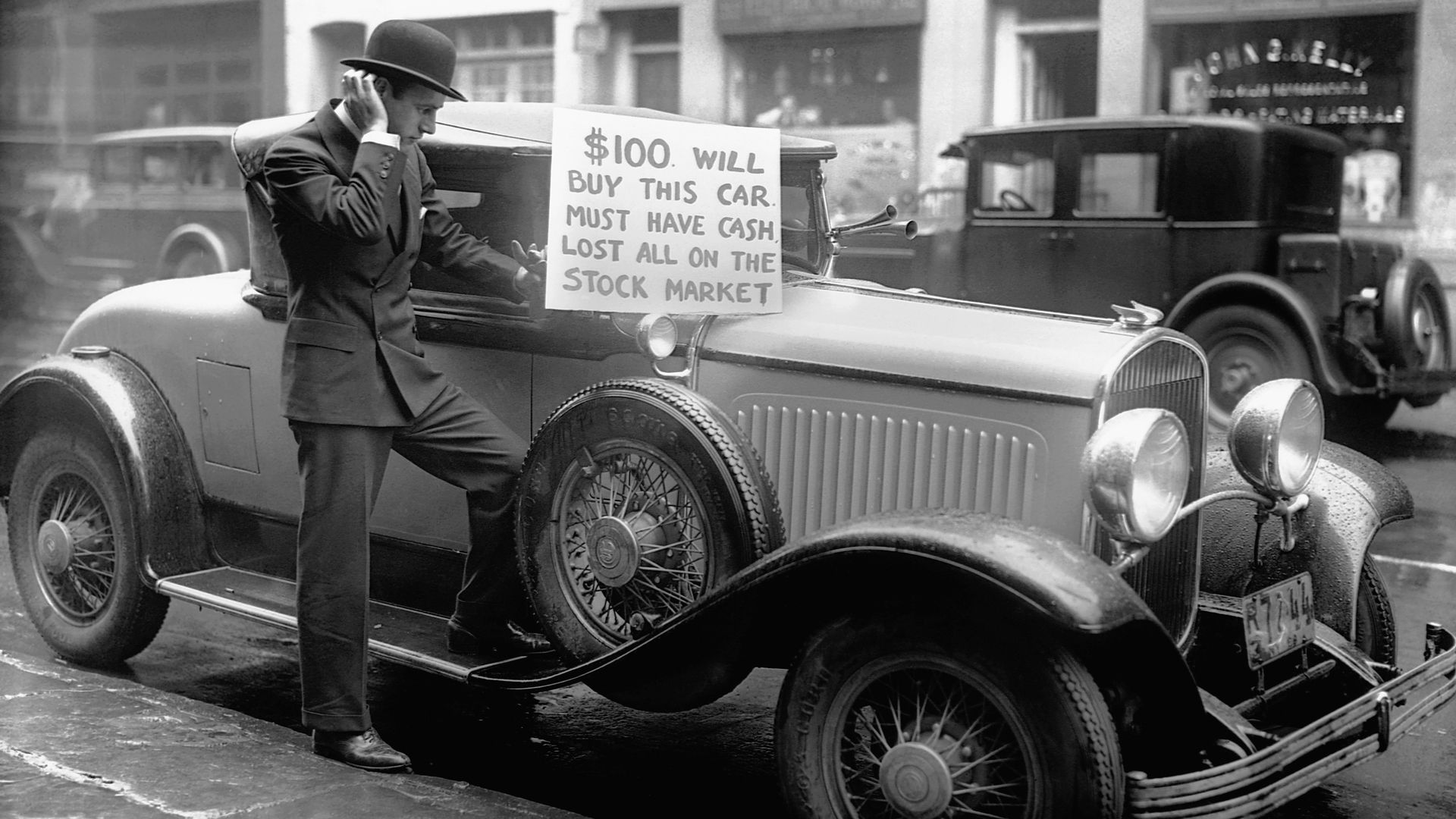 Black and white photo of a man selling his luxury car for $100