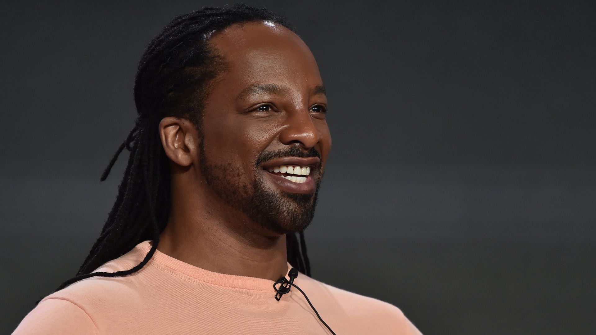 A close-up photo of Jericho Brown as he smiles.