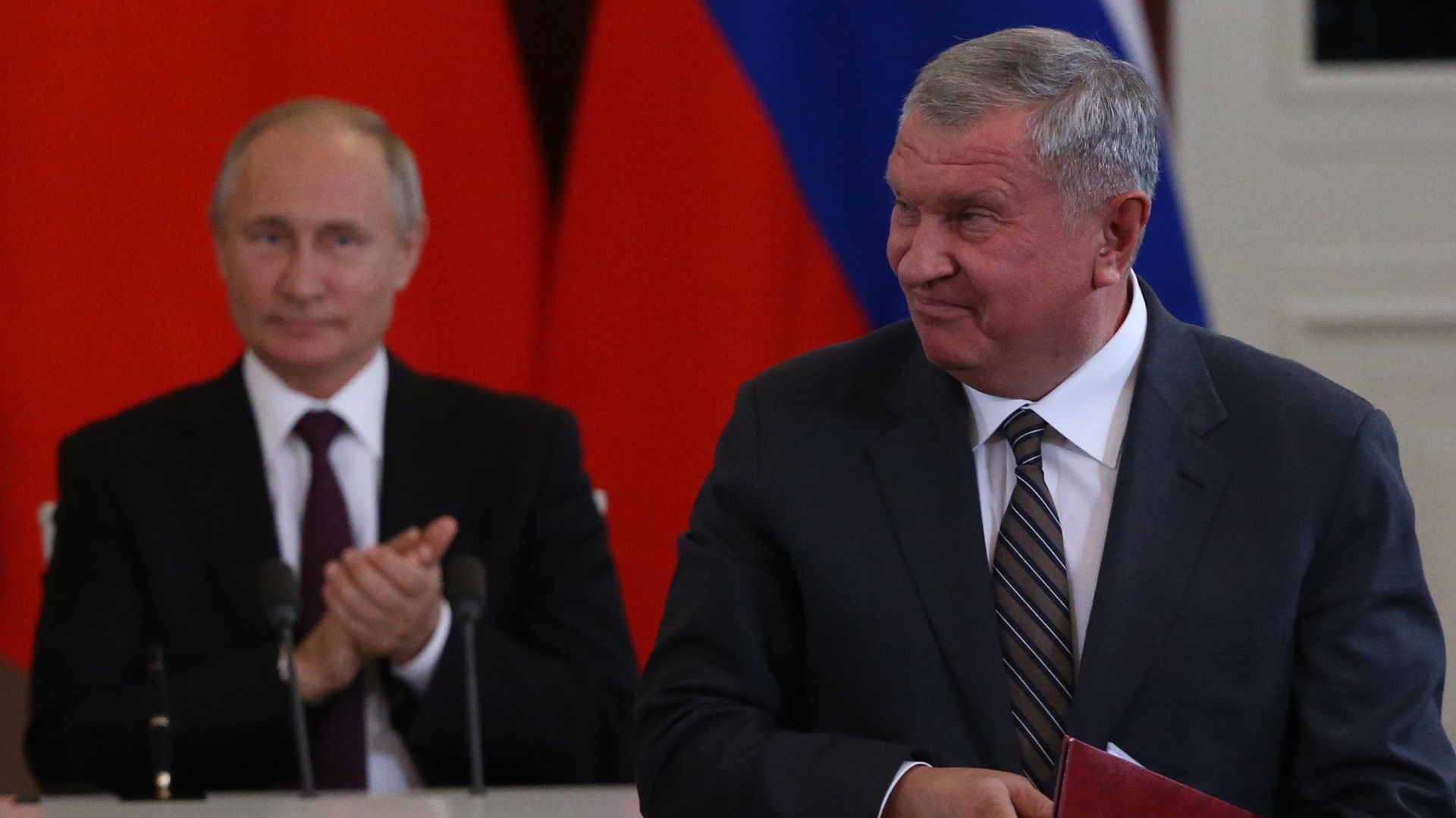 Russian President Vladimir Putin looking at Rosneft President Igor Sechin in Moscow in June 2019.