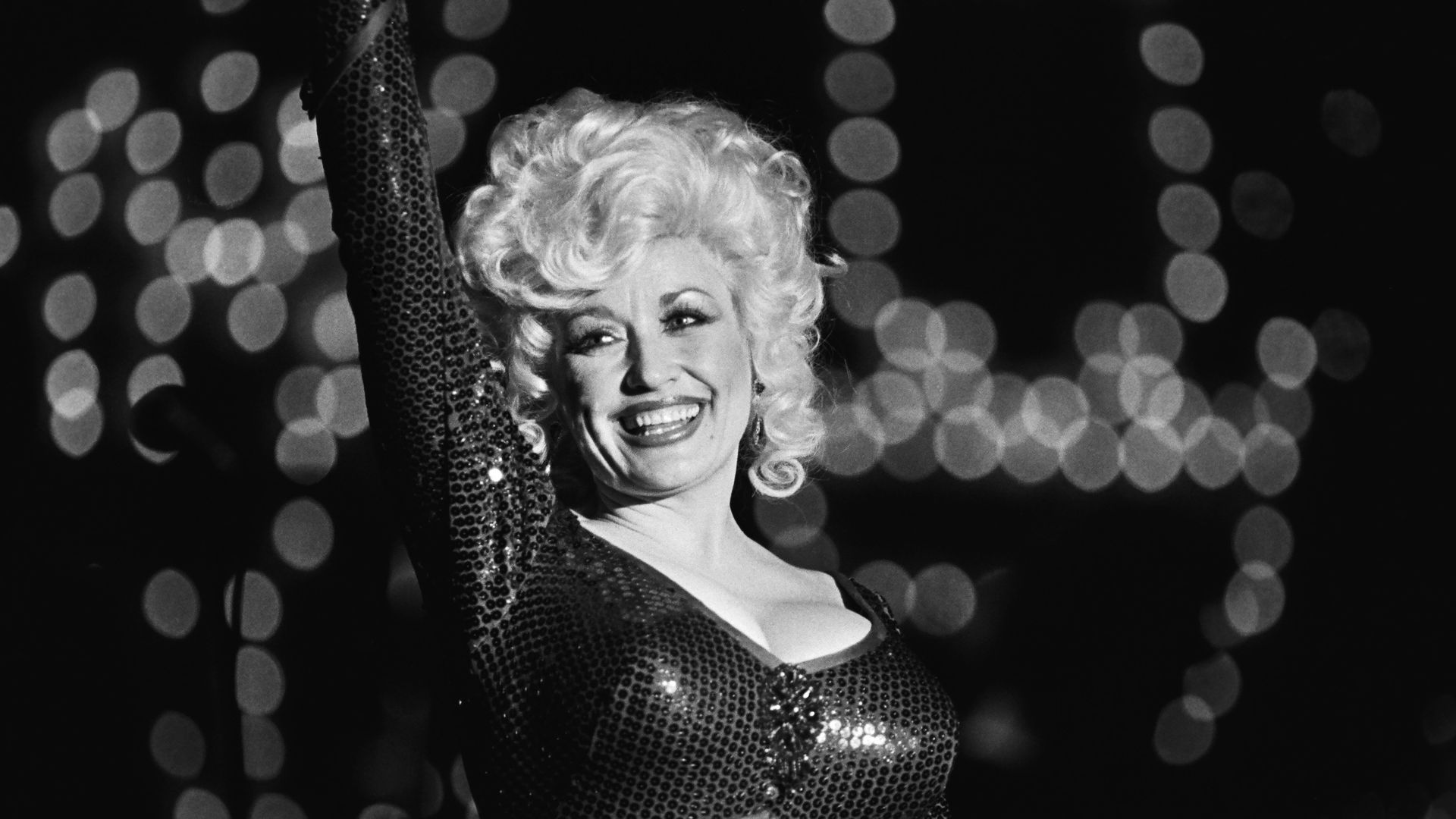 Dolly Parton smiles during a performance