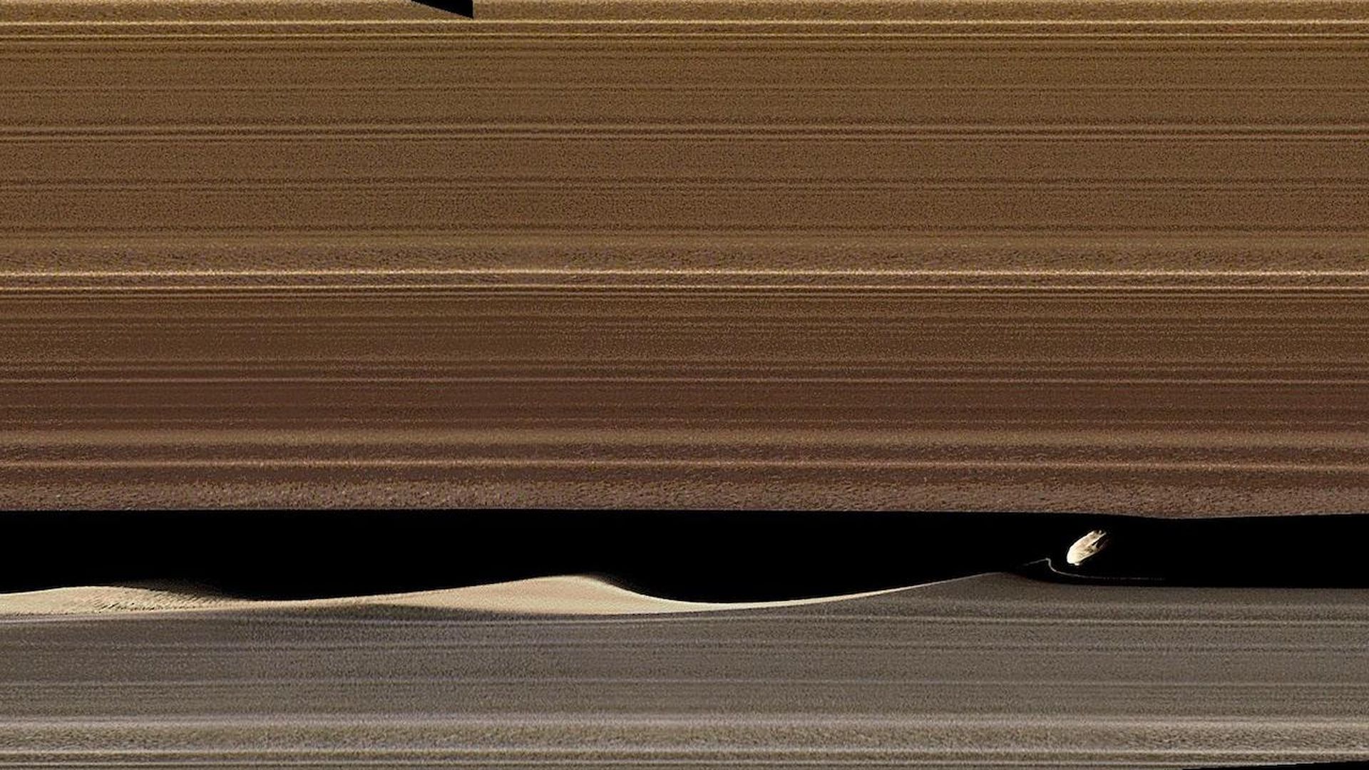 Daphnis in orbit around Saturn.