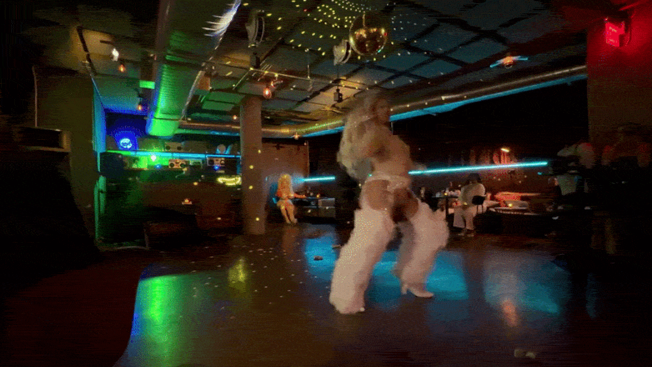 Candace Persuasion, one of Boston's biggest drag queens, dances to Beyonce at Spy Bar for the soft opening of Pride House in the South End during Pride Month and the World Cup.