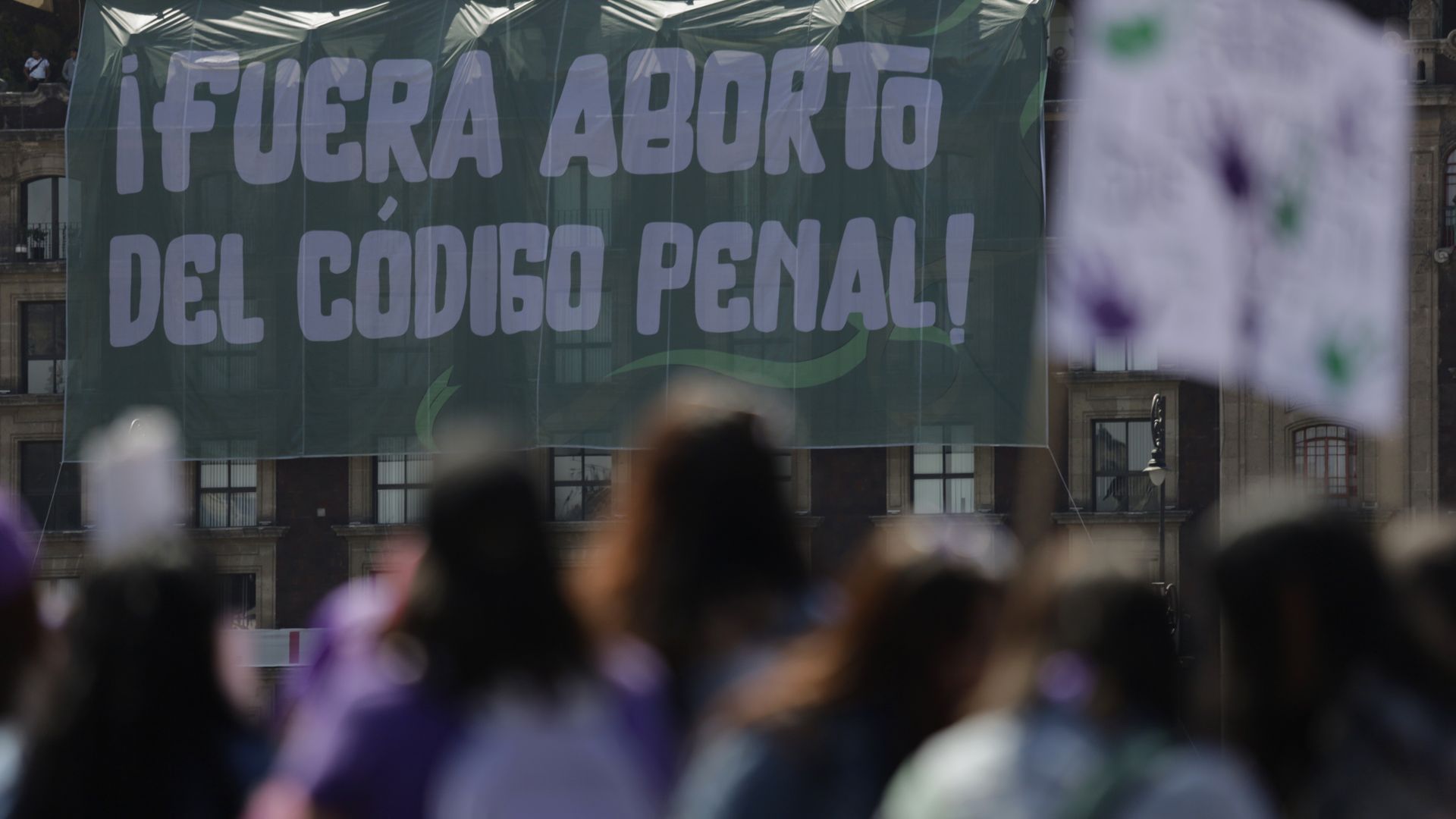View of a banner displayed from a building with the slogan Abortion Out of the Penal Code, as women's groups demonstrate outside the National Palace in Mexico City, on the occasion of International Women's Day in March.