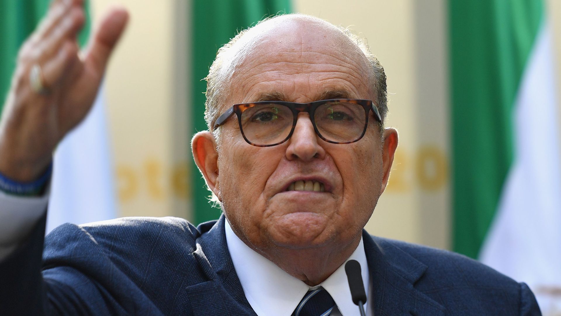 Giuliani gesturing with his hand.