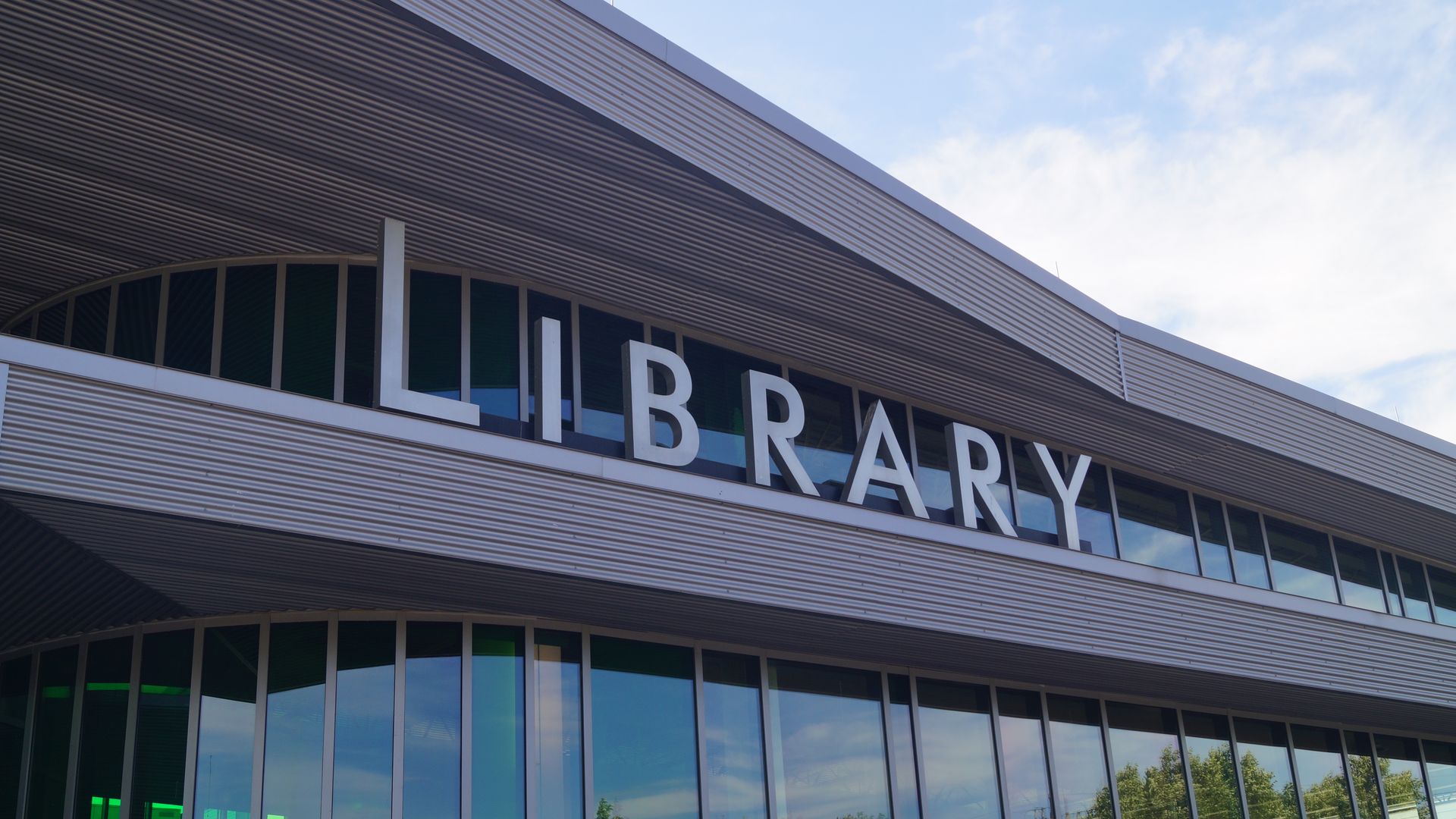 A modern library with "Library" signage 