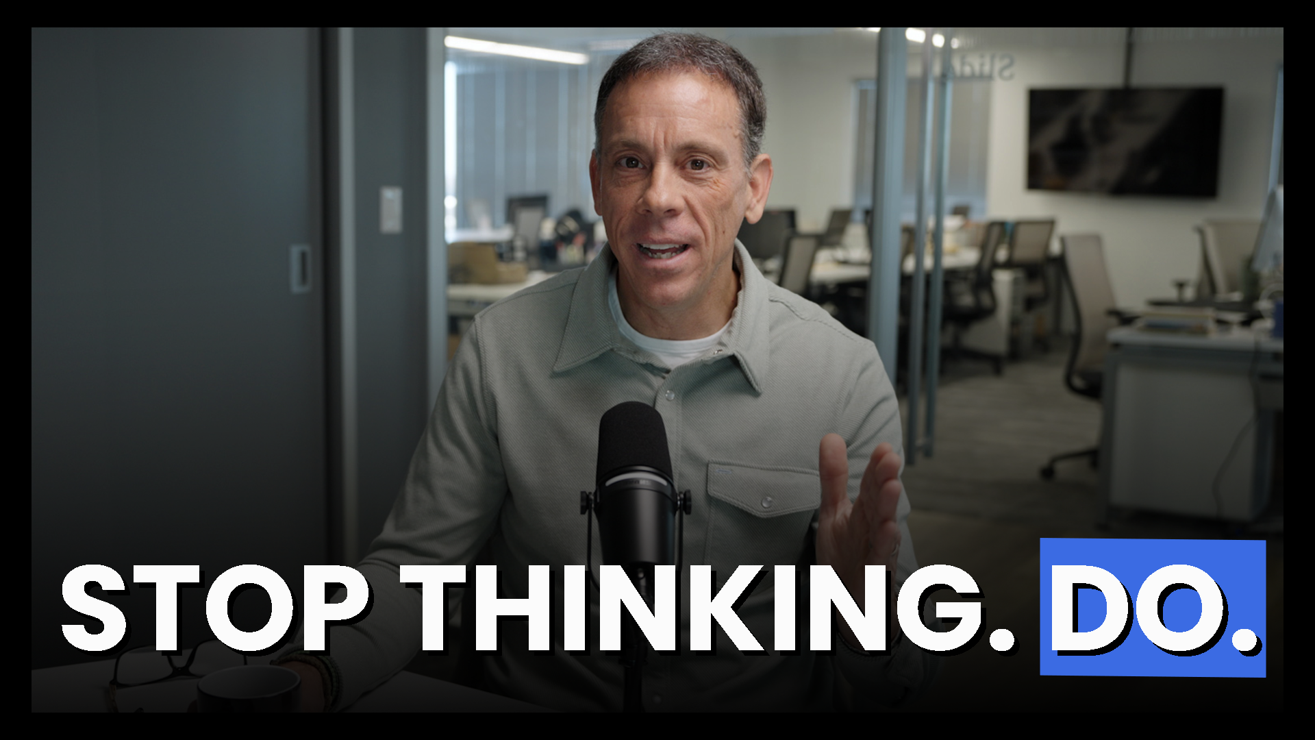 Jim VandeHei speaking into a microphone in an office setting, gesturing with one hand. Text overlay reads "STOP THINKING. DO." with "DO." highlighted in blue.