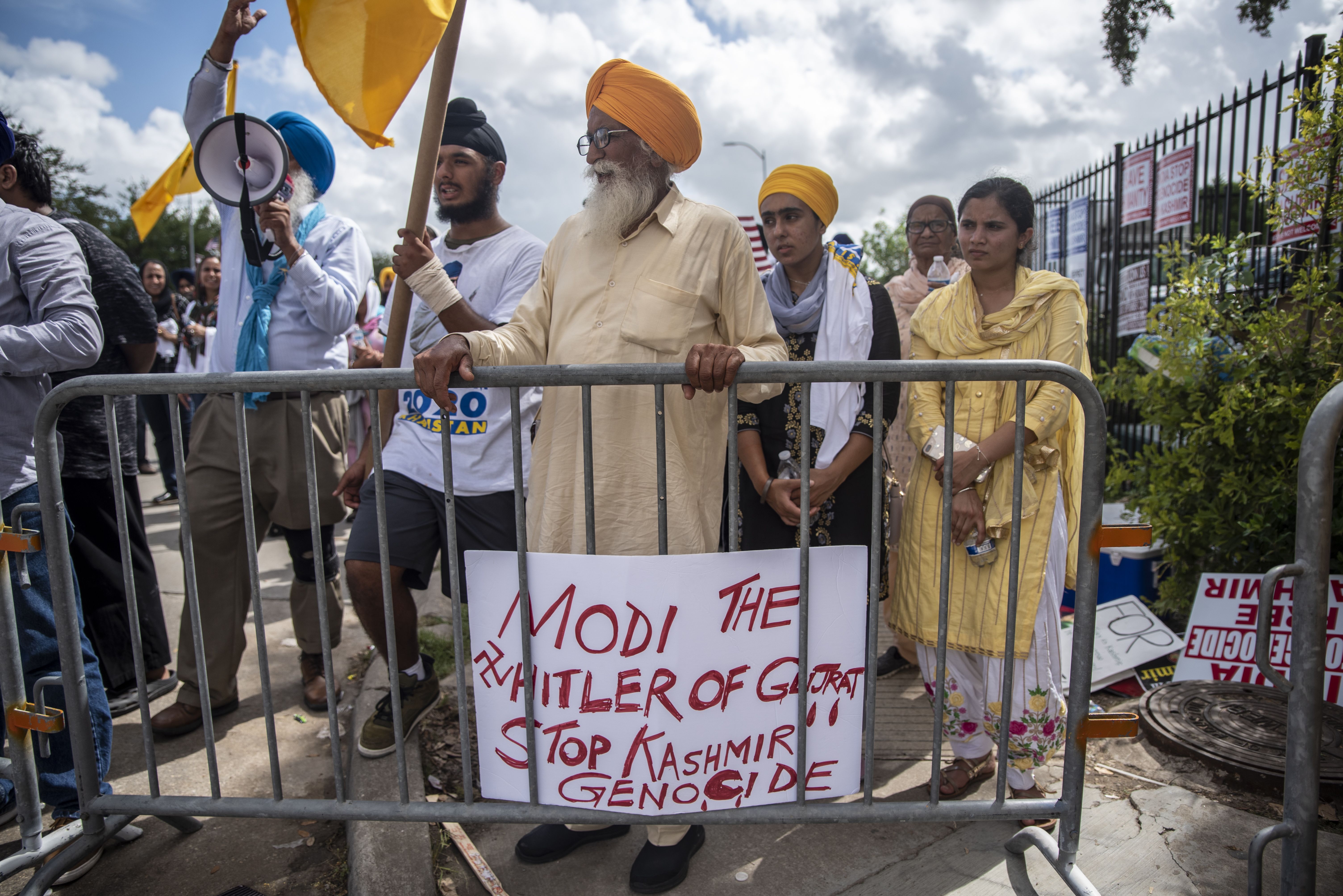 Protesters chant and wave flags outside after a rally attended by Indian Prime Minister Narendra Modi at NRG Stadium on September 22, 2019 in Houston, Texas.