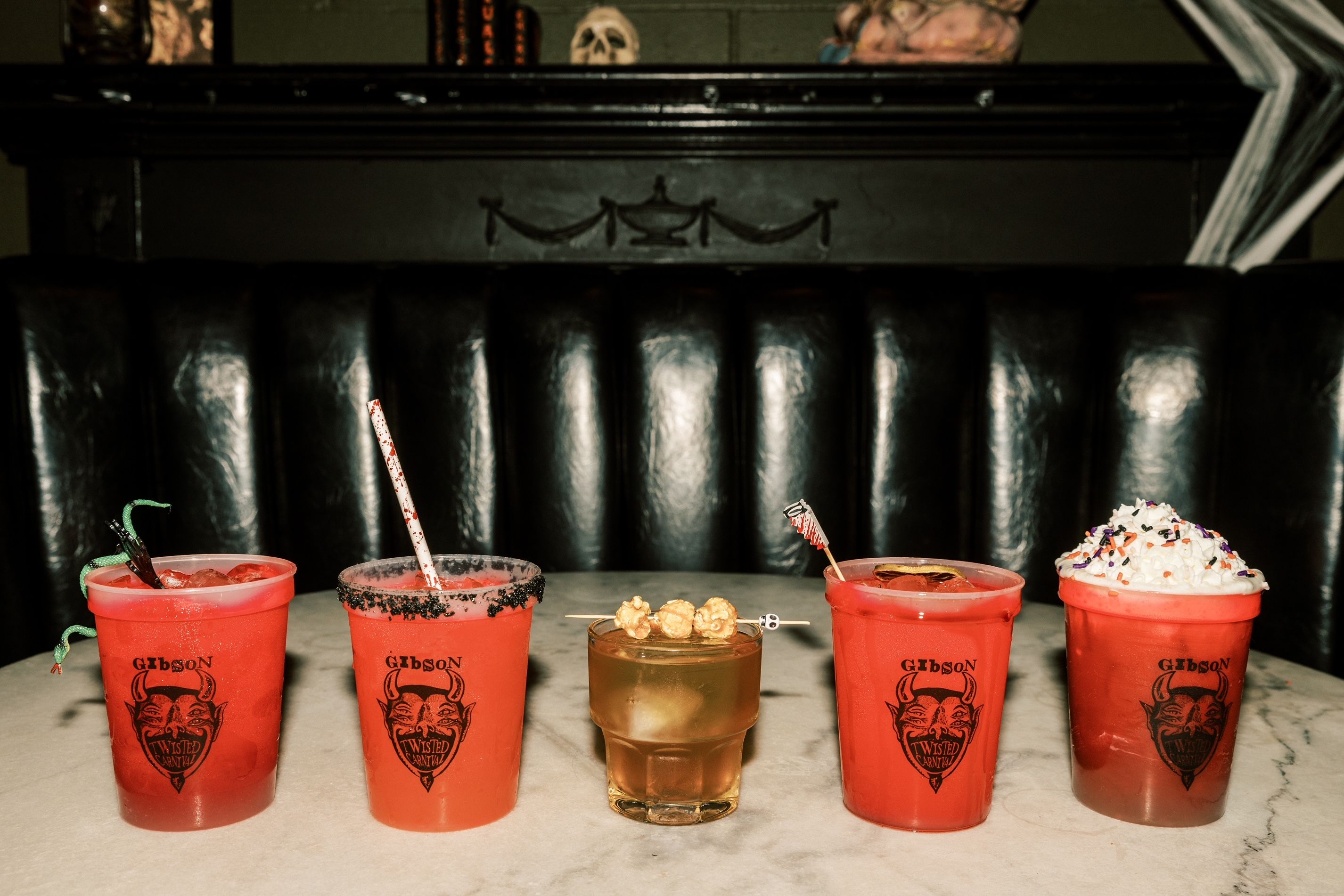 A photo of five drinks in a row.