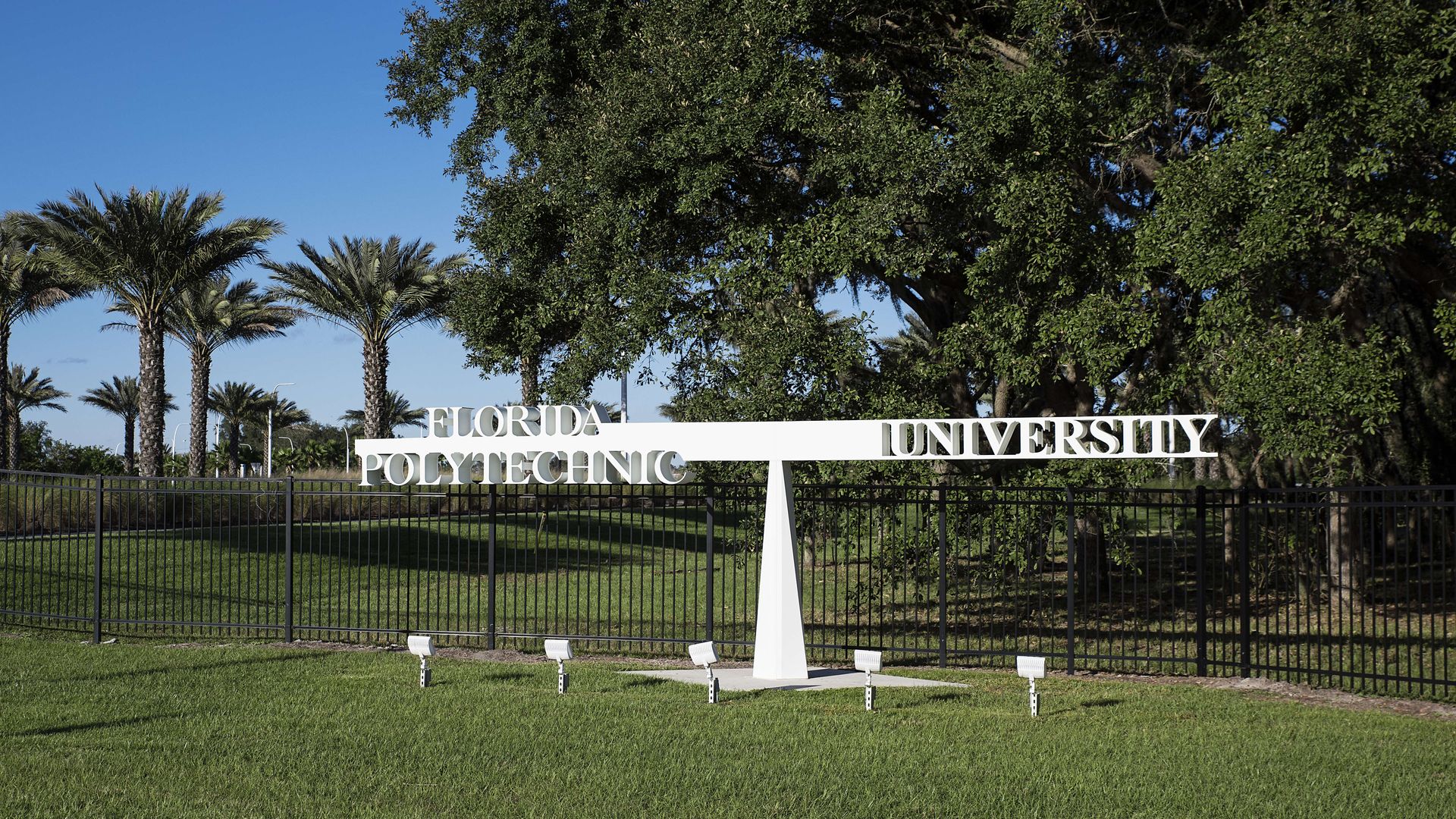 A white sign that reads "Florida Polytechnic University." 