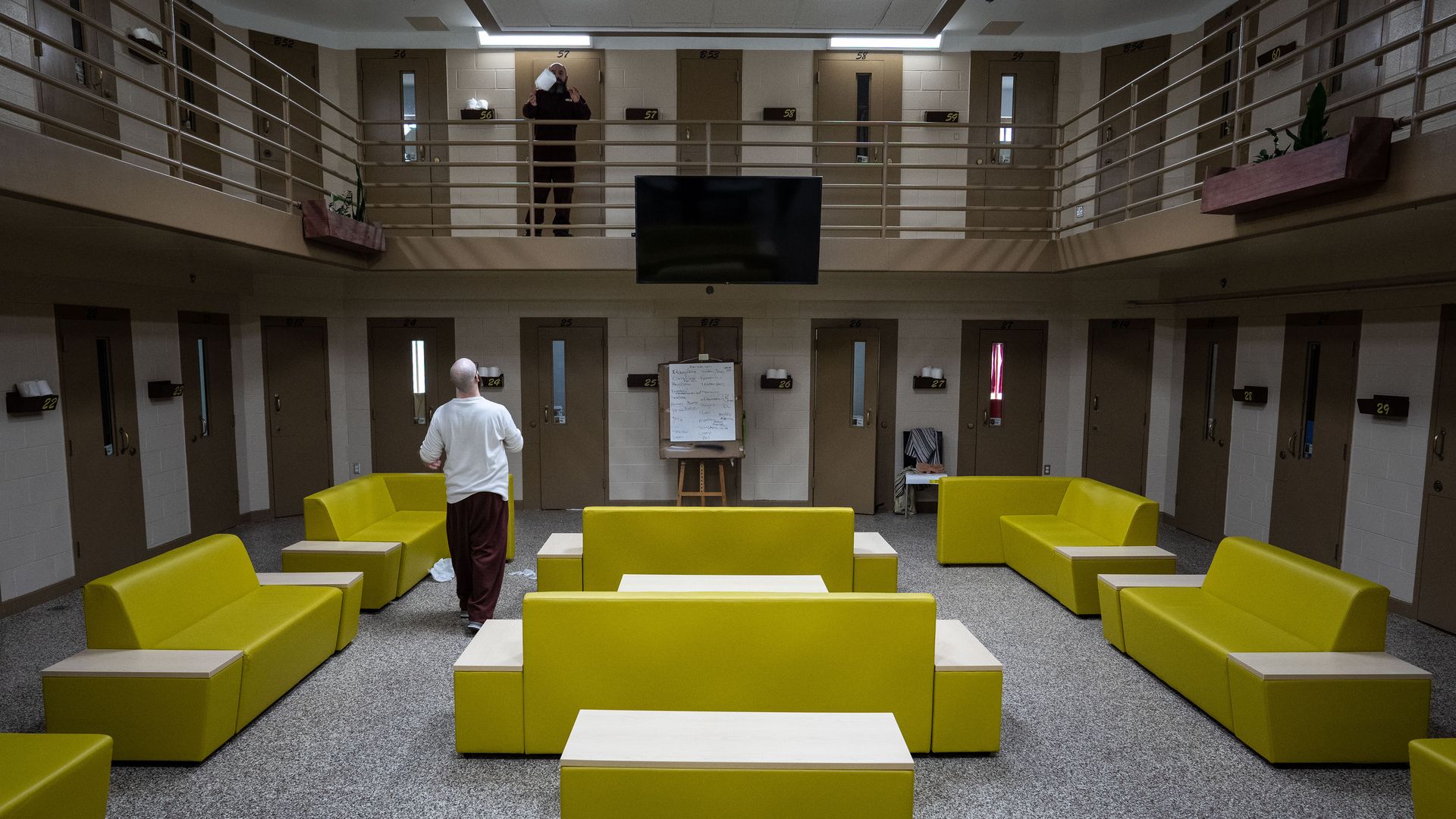 An inmate tosses a toilet paper roll to the second floor in the Little Scandinavia unit at SCI Chester.