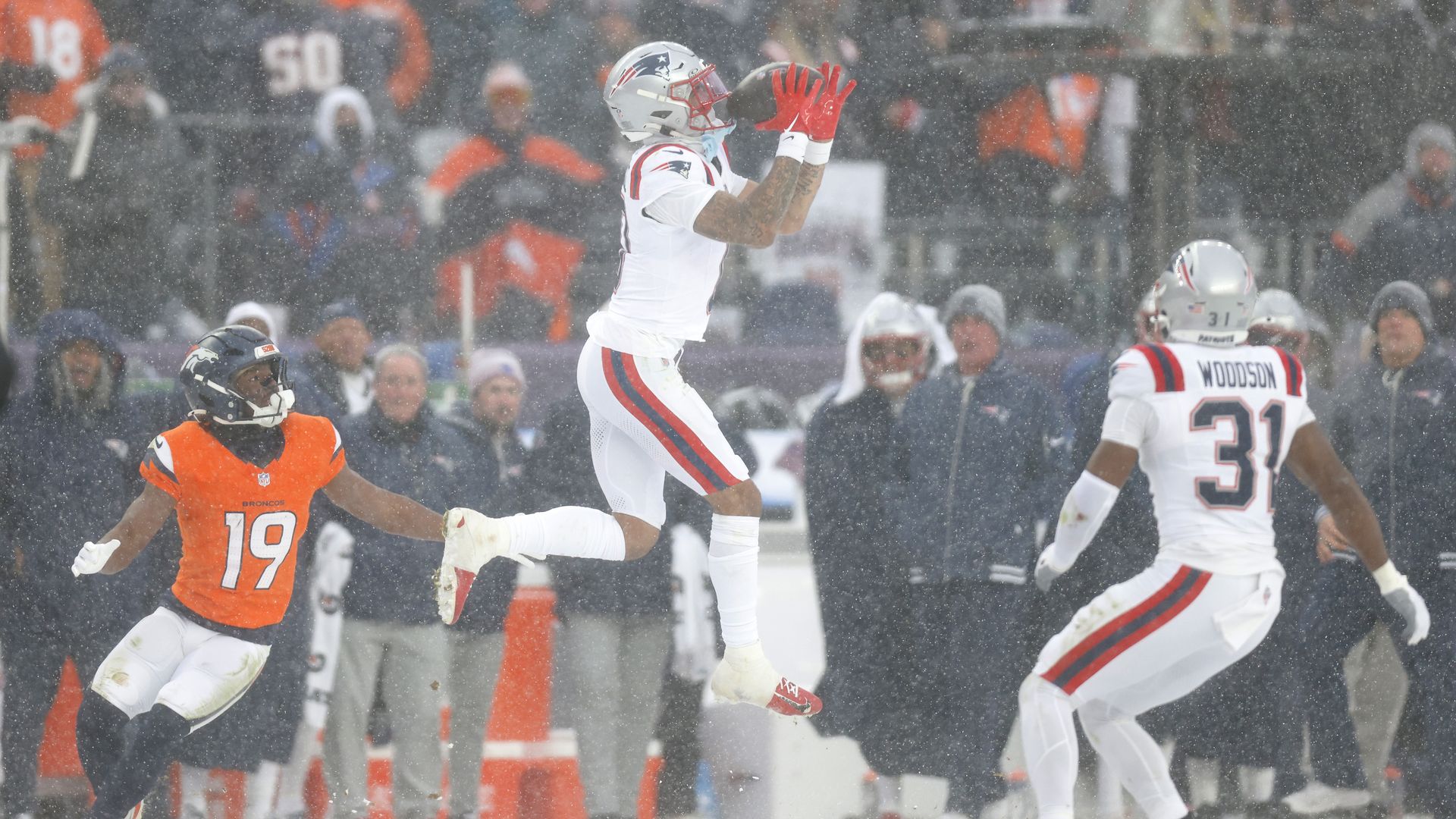 Christian Gonzalez #0 of the New England Patriots intercepts a pass from Jarrett Stidham #8 of the Denver Broncos (not pictured) intended for Marvin Mims Jr. #19 during the fourth quarter in the AFC Championship Playoff game at Empower Field At Mile High on January 25, 2026 in Denver, Colorado. 