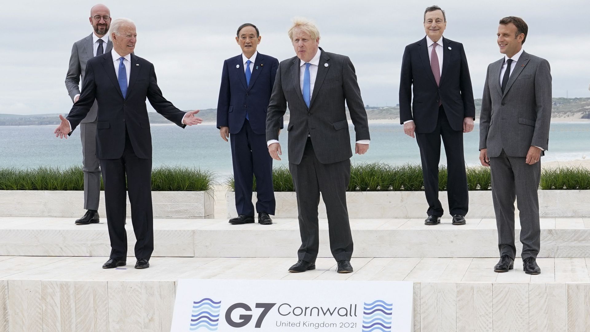 President Biden is seen with British Prime Minister Boris Johnson and French President Emmanuel Macron.