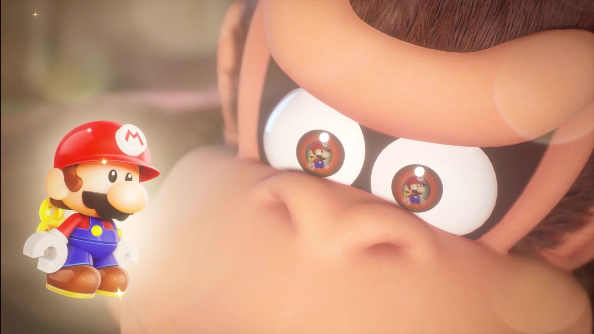 Video game screenshot of close-up of Donkey Kong's eyes as he looks at a wind-up toy version of Mario