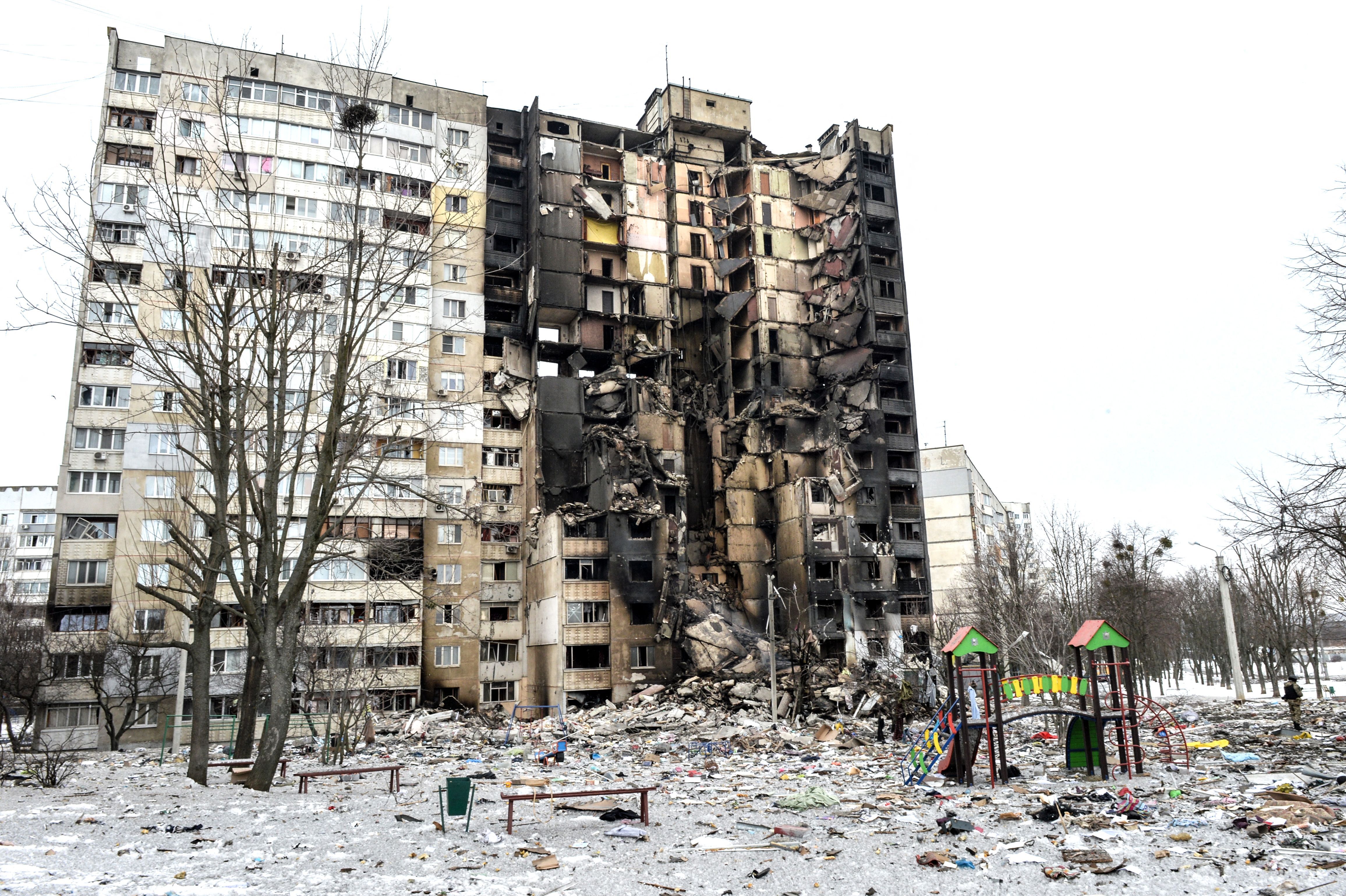 An apartment building damaged after shelling the day before in Ukraine's second-biggest city of Kharkiv on March 8.
