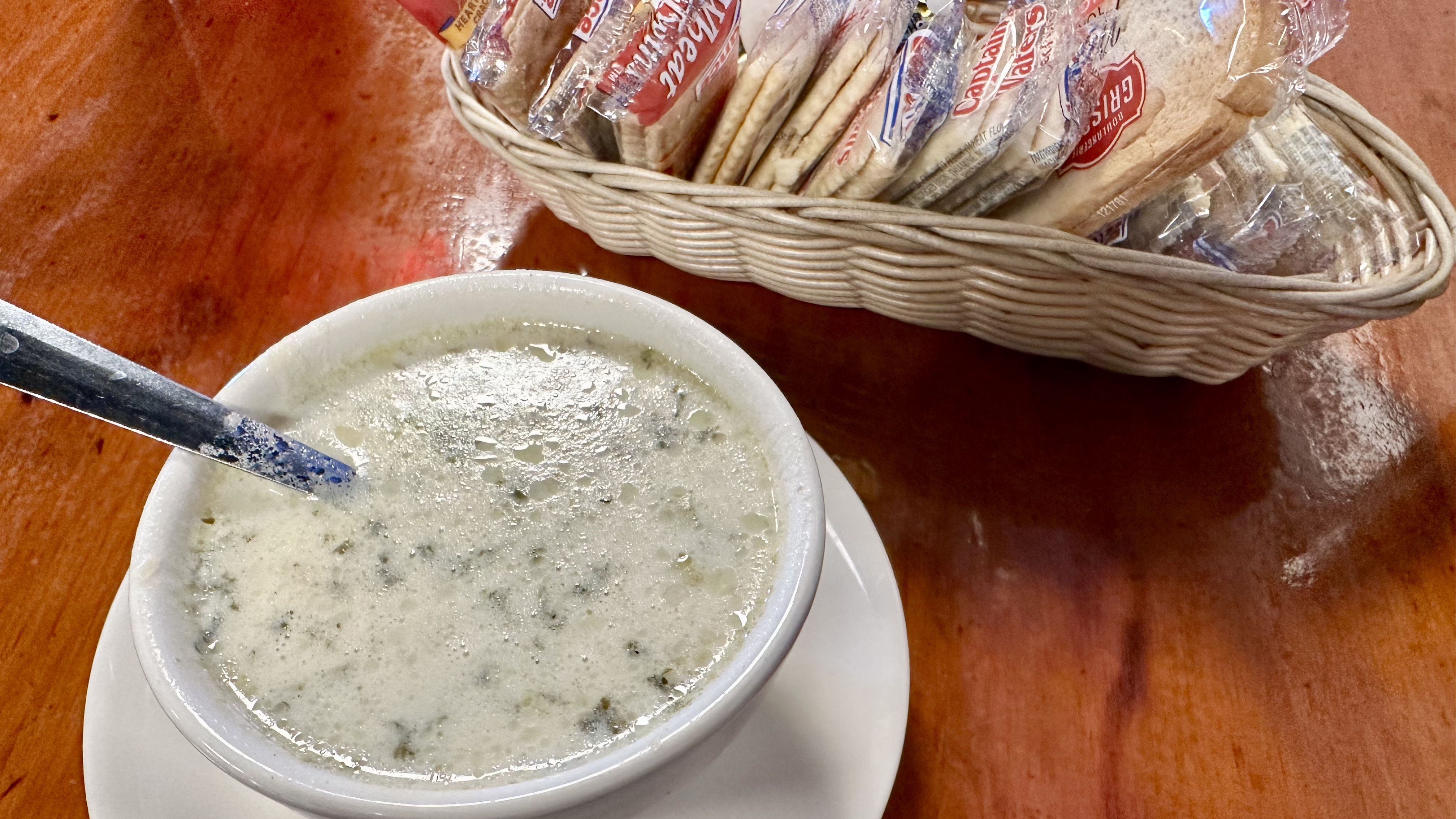 Photo shows a bowl of a cream-based oyster soup at R&Os.