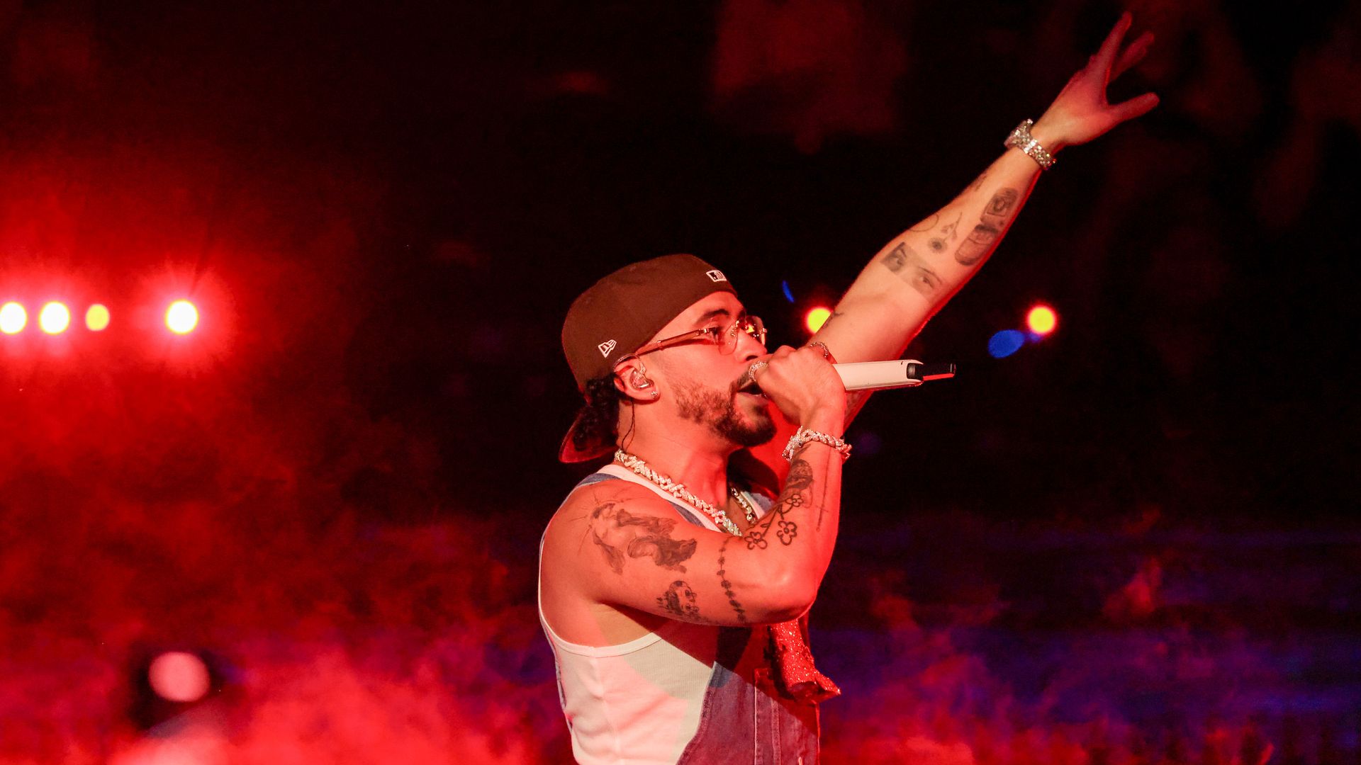 Bad Bunny performs on stage. 