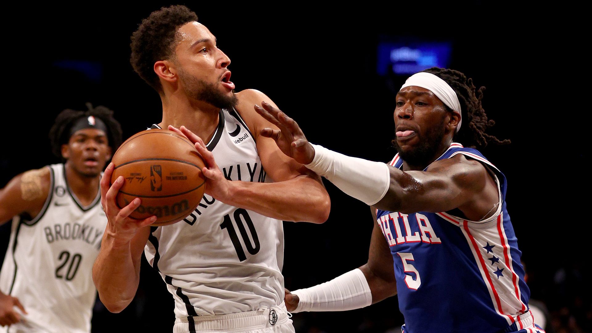 Brooklyn Nets guard Ben Simmons drives past the Sixers' Montrezl Harrell.