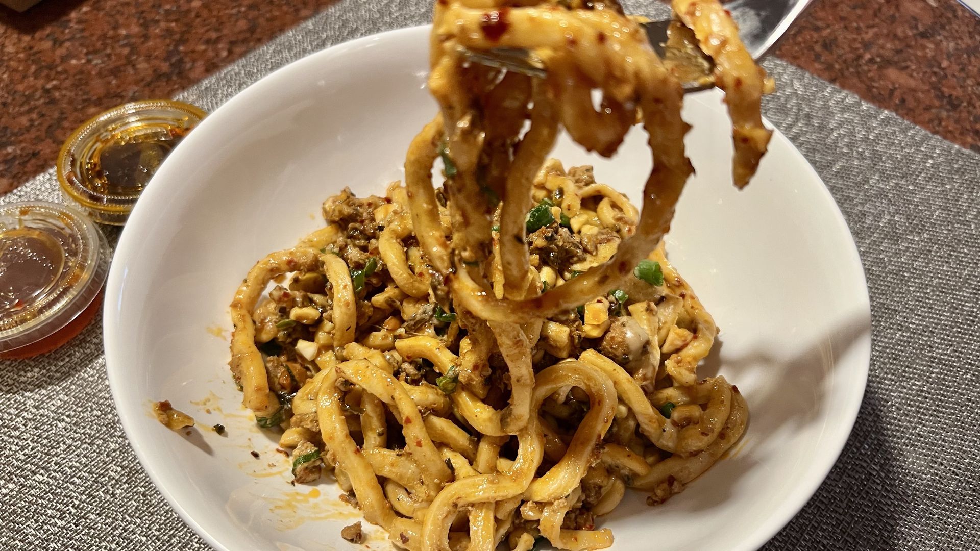 Photo of a bowl of Dan Dan noodles. 