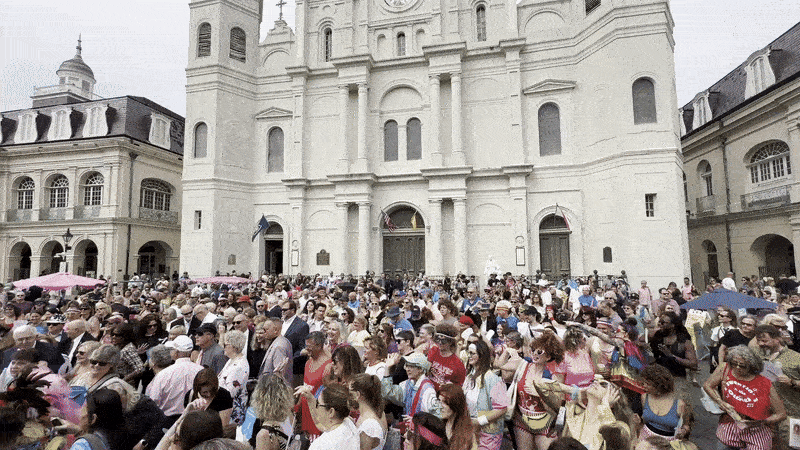 A crowd moves in unison during a workout in Jackson Square.