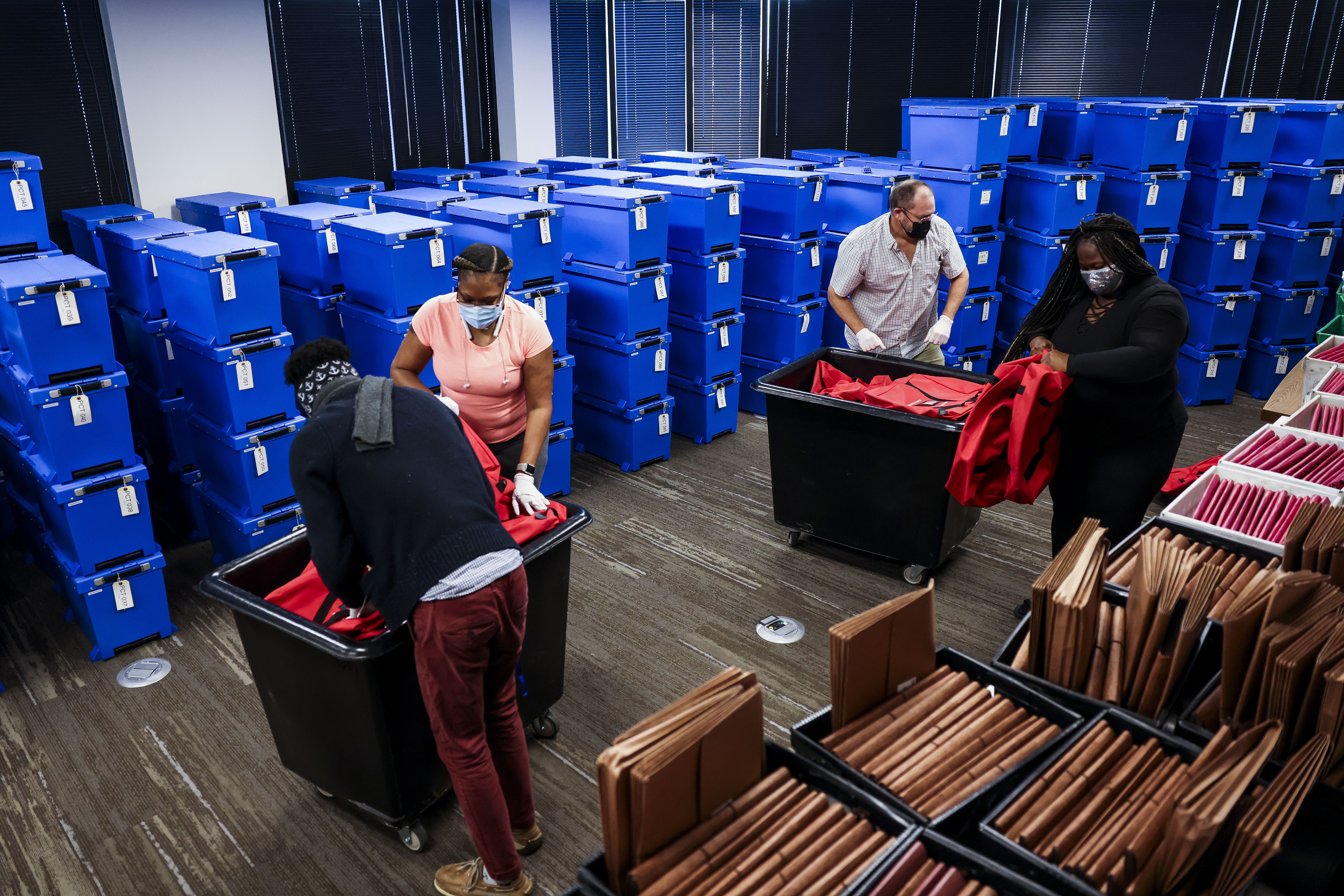 North Carolina officials sort counted ballots. Photo: Michael Ciaglo/Getty Images