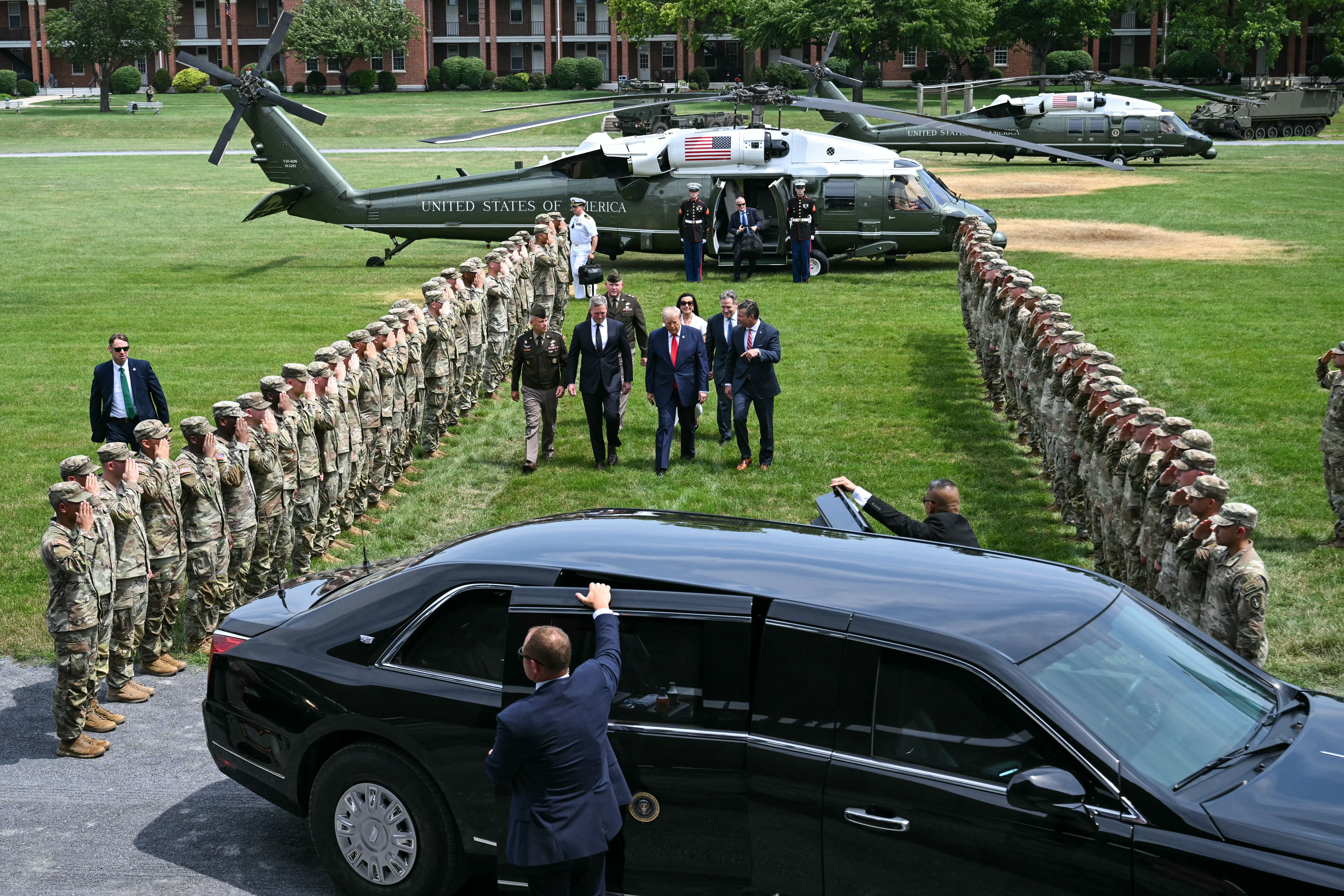 President Donald Trump arrives yesterday at the Pennsylvania Defense and Innovation Summit at the U.S. Army War College in Carlisle, Pa., accompanied by Defense Secretary Pete Hegseth; Sen. Dave McCormick (R-Pa.), the event's host; and Dina Powell McCormick.