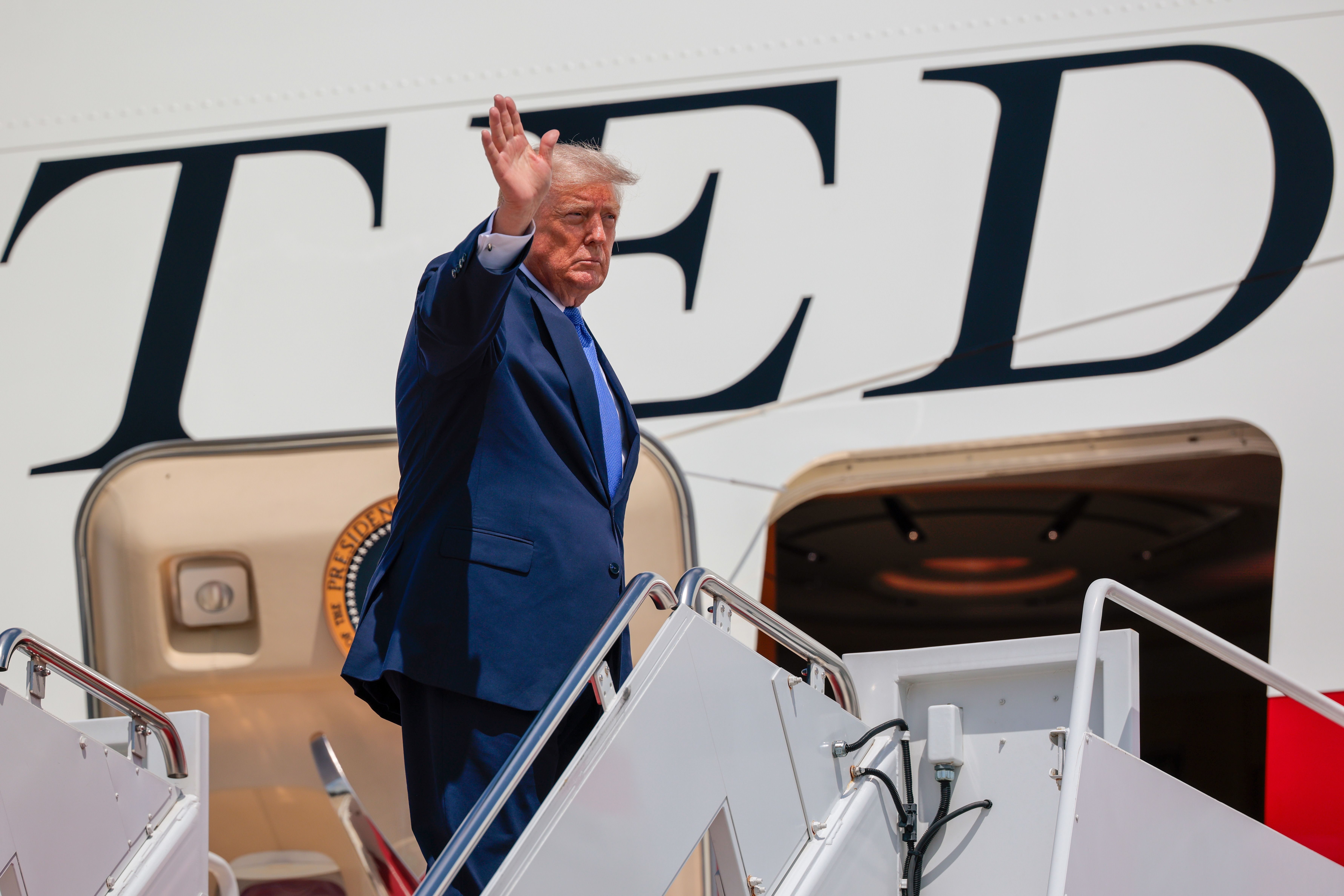 President Trump boards Air Force One before departing on a trip to Los Angeles for a fundraiser.