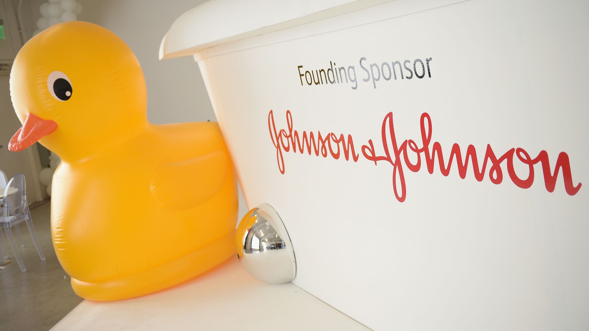 The Johnson & Johnson sign next to a rubber duck. 
