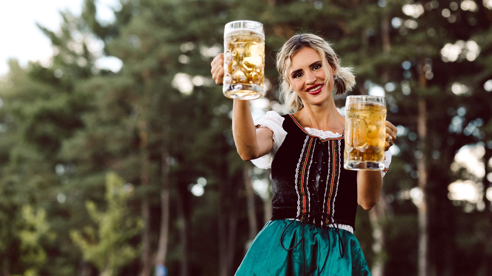 Lady holding beer steins