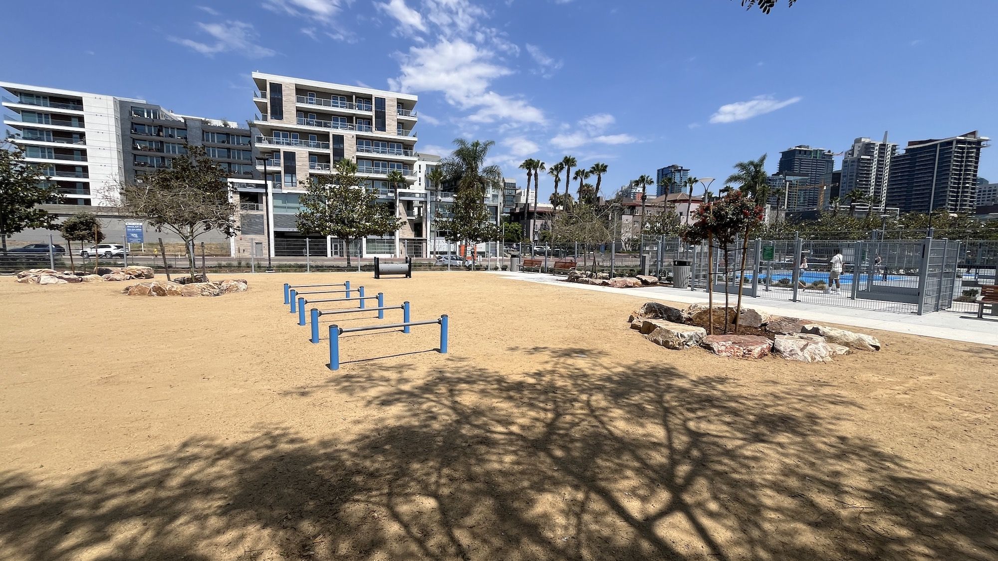 A dog park with agility equipment.
